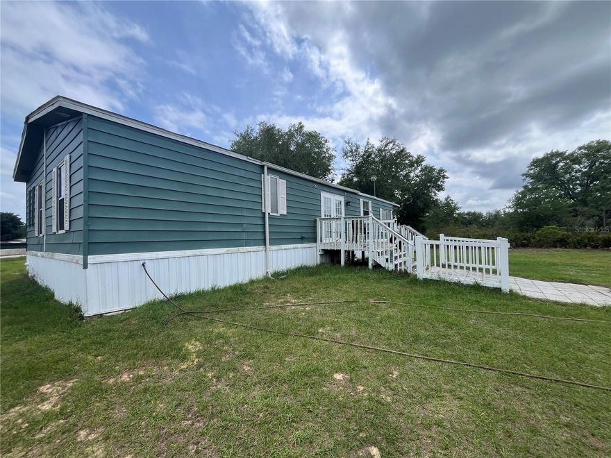 2+ ACRES IN THE COUNTRY IN CENTRAL FL, FOR SALE! Two parcels sold together. Are you tired of seeing subdivisions everywhere you go? Want to be out away from the hustle and bustle? Look no further! 3/3 manufactured home on 2.2 acres, surrounded by natural Florida land. ARTESENAL WELL with excellent natural pressure, no water bill! BETTER THAN BOTTLED WATER, no filtration system needed! Home has been remodeled inside, replumbed & new 4.5 ton a/c. New bathrooms, fixtures, flooring and newer interior paint. Private bathrooms for every bedroom. Gas dryer. Well maintained and cared for. 50 ft wide by 400 ft deep private driveway. Underground utilities, no power lines getting in the way of star gazing! Land is set up for a chicken farm, owner will leave a few of the structures for new owner. Large pole barn with power and water. Paved sitting area under the shade. Land is partially fenced. Scrub oaks, scrub palmettos, wild flowers, wild life; Enjoy peace and serenity of natural Florida. Close to town. 1.5 hr to Florida beaches, 1 hr to Orlando, 30 in to Winter Haven. Don't miss this piece of Heaven. Go see today!