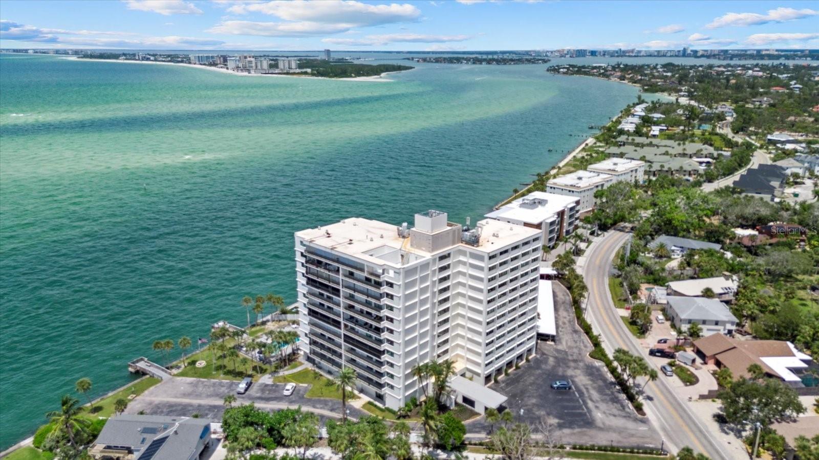 Perched high above the shoreline, Residence 8C at Siesta Towers delivers nearly 360-degree views spanning the Gulf, Big Pass, Sarasota Bay, and the twinkling downtown skyline. From glowing sunsets to sparkling city lights, this vantage point is among the most extraordinary on Siesta Key.
Rarely available, this three-bedroom, three-bath residence has just undergone a complete, top-to-bottom remodel. Every detail was thoughtfully curated with today’s luxury buyer in mind—offering the ease of brand-new finishes within an iconic Siesta Key location.
Designed with a sleek, modern aesthetic, the open floor plan showcases impact-rated windows and sliding glass doors, wide-plank luxury flooring, custom recessed lighting, and a seamless indoor-outdoor flow. The all-new designer kitchen is appointed with quartz countertops, custom soft-close cabinetry, premium stainless-steel smart appliances, and a striking island ideal for entertaining. Each of the three en-suite bathrooms has been fully redesigned with spa-level finishes, frameless glass showers, elegant tilework, and contemporary fixtures. The spacious primary suite is a retreat in itself, featuring a tranquil en-suite bath and panoramic water views.
Siesta Towers is a secure, well-managed waterfront community offering an enviable lifestyle. Building amenities include secure access-controlled entry, 24/7 security, a remodeled club room, fitness room, heated waterfront pool, BBQ grills, fishing dock, social dock, bike storage, and more. Just beyond your door, Siesta Village’s restaurants, shops, and nightlife are a short stroll away, with the powdery sands of world-renowned Siesta Beach minutes from home.
This residence combines the rarity of a three-bedroom layout with a brand-new, complete remodel and nearly all-around views—an exceptional opportunity to own one of Siesta Key’s most striking vantage points.