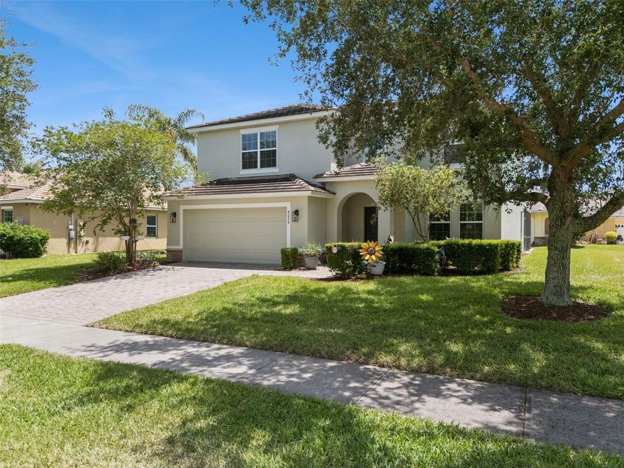 Welcome to Calabria at Westside, where resort-style living meets everyday comfort just minutes from Central Florida’s world-famous attractions. Situated on a nicely sized corner lot in this beautifully maintained community, this Mediterranean-inspired pool home offers 6 bedrooms, 3 full bathrooms, 1 half bath, and a spacious upstairs family room, creating the perfect blend of flexibility, comfort, and style.From the moment you arrive, you’ll appreciate the curb appeal and welcoming feel of the neighborhood. Step inside to a spacious entryway accented by porcelain tile, with a formal dining room just off the foyer that could also serve beautifully as a home office or flex space.The heart of the home features an open-concept kitchen, living room, and dinette, designed for gathering and entertaining while enjoying views of the sparkling screened-in pool. The first floor also includes a convenient half bath, garage access, and a generously sized primary suite with sliding glass doors overlooking the pool, a walk-in closet, and a spacious ensuite bath.Upstairs, you’ll find a huge family room/bonus space that offers endless possibilities for a second living area, game room, or media space. The thoughtfully designed split-bedroom layout places 2 bedrooms and a full bath on one side, with 3 additional bedrooms and another full bath on the other. The largest upstairs bedroom is located at the front of the home and is currently being used as an impressive office space.Step outside to enjoy your screened-in lanai and private pool, perfect for relaxing after a day at the parks or entertaining family and friends.As an added bonus, the reasonable HOA includes lawn care, cable, and internet, making ownership even more convenient. And if you’d like to meet your neighbors, simply step outside for a stroll through this active, well-kept community where you’ll often see residents enjoying their daily walks with their four-legged family members.This is your opportunity to own a spacious, well-appointed Central Florida retreat in a sought-after location close to shopping, dining, and area attractions.