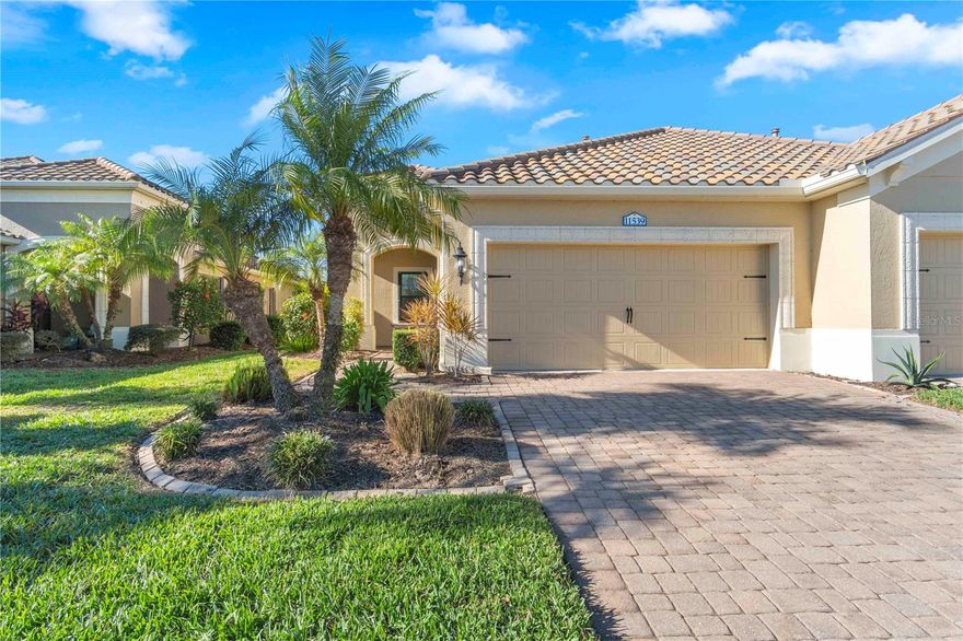 Just listed in the highly desirable Grand Palm community. This 2016 Crystal Sand model villa is maintenance-assisted and truly move-in ready. The light and airy open-concept floor plan features ceramic tile throughout and is thoughtfully designed for both comfort and effortless entertaining. The home offers two bedrooms, two baths, a den, a split-floor plan layout, and a two-car garage. The spacious living room and kitchen combination creates an inviting gathering space, enhanced by plantation shutters, a tray ceiling, ceiling fans throughout, and abundant of natural light.  Sliding pocket doors open to an extended lanai overlooking tranquil gardens and a natural preserve, providing a peaceful indoor-outdoor living experience. An added courtyard area offers additional outdoor space, ideal for relaxing or entertaining guests. Hurricane shutters provide added peace of mind, along with a privacy screen for evening comfort. Additional upgrades include reverse osmosis, pull out drawers, a whole-house water purification system, a radiant barrier shield in the attic to help keep the attic and garage cooler, and foam insulation added to the exterior concrete block walls for improved energy efficiency.  Residents of the Okaloosa neighborhood enjoy a private pool and spa, as well as a BBQ area and seating for social gatherings. Grand Palm’s resort-style amenities include three community pools, a social club, the Palm House state-of-the-art fitness center, scenic walking trails, parks, and pickleball courts. This exceptional villa offers the perfect blend of low-maintenance living and the relaxed Florida lifestyle you've been looking for.
