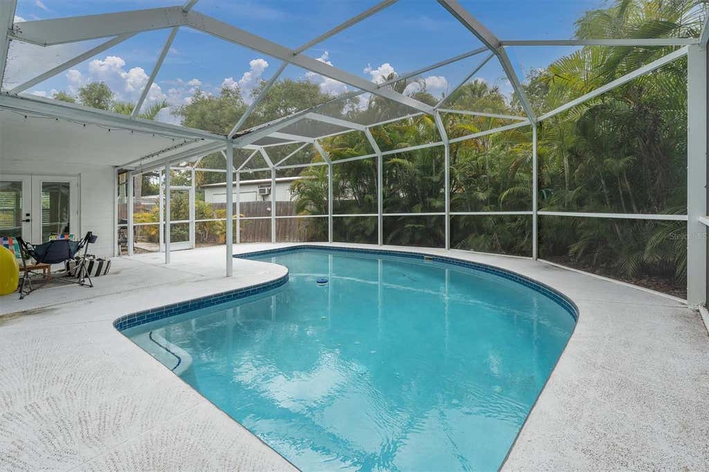 Photo of 4986 Woodland Drive, St Petersburg, FL 33708 (MLS # TB8530083)