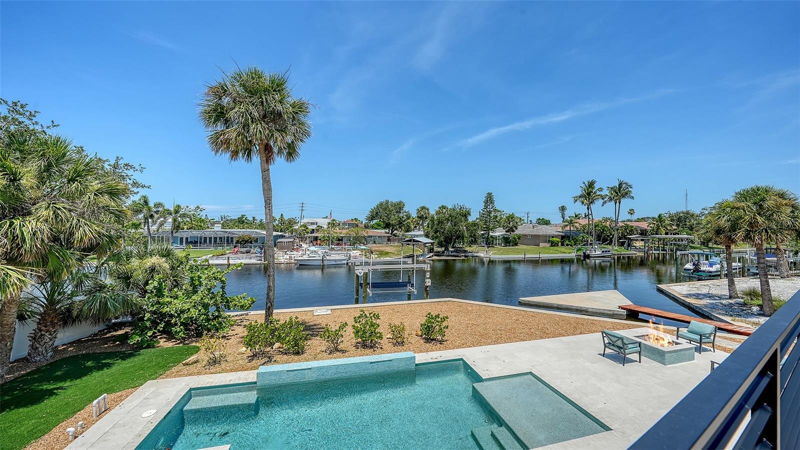 Beautifully Newly Upgraded Waterfront Home on Siesta Key – 4BR | 3BA | Canal Front | Solar-Powered Discover your private oasis in this beautifully updated two-story home located directly on Siesta Key Island. Nestled at the end of a quiet cul-de-sac, this 4-bedroom, 3-bath residence offers the perfect blend of luxury, comfort, and island living — all within an A+ rated school district. Waterfront Living at Its Finest Set along a peaceful canal with easy boating access to the Intracoastal and Gulf of Mexico, this home is a dream for water lovers. NEW Roof 2025, NEW Hurricane Impact Doors & Windows 2024, NEW 10,000 lb Boat Lift, Sea Wall, Heated Pool & Spa, whole house Generac natural gas Generator. Enjoy fishing, kayaking, or paddleboarding from your backyard, or simply relax as palm trees sway. Sunset skies paint your view in stunning pastel colors. Thoughtful Layout & Design the main living space is on the second level, maximizing natural light and treetop views through large new impact sliding glass doors and windows. The Florida room and open living areas provide a bright and airy feel, complemented by a dimmer-controlled lighting system. •Primary suite is privately located just off the main living area . •Gourmet kitchen includes a GE Elite fridge/freezer and dishwasher, JennAir gas stove and microwave, reverse osmosis water filtration system, and stylish finishes. •Additional rooms include a large office, bonus room, and dedicated laundry room—perfect for modern living. Upgrades & Features •38-panel solar energy system (installed 2019) •Beautifully landscaped even a Putting Green •Ample outdoor space for relaxing or entertaining Location, Location, Location minutes to world-renowned Siesta Key Beach, dining, shopping, and all the conveniences of Sarasota for a relaxed coastal atmosphere. This rare MOVE IN READY canal-front gem offers a true slice of paradise on one of Florida’s most coveted barrier islands.