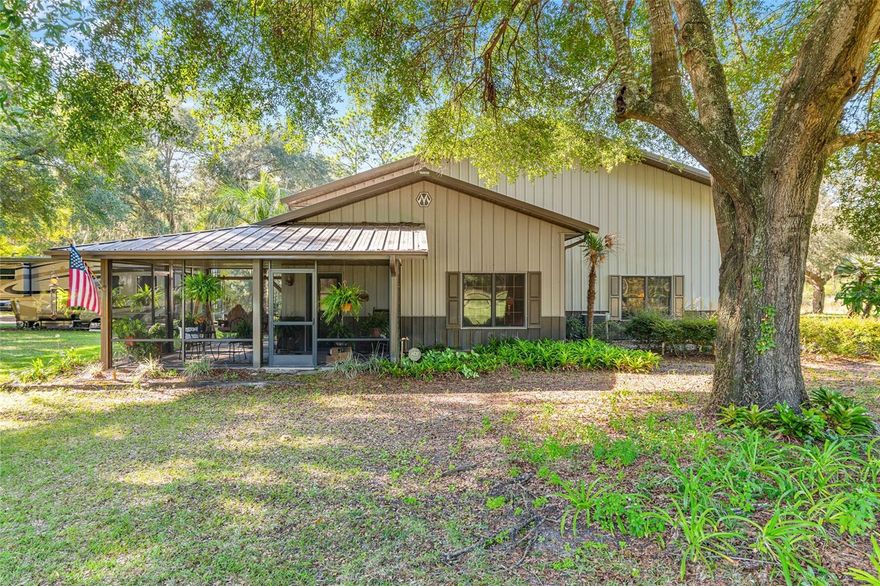 Welcome to your very own slice of paradise — or at least a fantastic place to set up shop! This 21-acre gem features a Morton Barn that’s as versatile as your favorite Swiss Army knife. It’s got plenty of space under heat and air, a cozy office with bathrooms (because who wants to work in sweat or need a detour to the house?), a production kitchen for whipping up whatever your heart desires, and rooms for storage and product creation — perfect for turning a hobby into a hustle or just hiding from the world for a bit. Most recently, the living space has served as a comfy residential haven, so you know it’s got good bones. The barn’s giant equipment bay with three oversized doors makes parking even your largest toys a breeze, and the loft above is just waiting for your extra stuff. On the south side of the barn, there’s a full RV hookup — so your friends and family can roll in and feel right at home. Once a thriving wholesale plant nursery, this farm comes with irrigation, nursery structures, and two wells — because water is life, especially when you're nurturing nature, raising livestock or keeping those plants (and maybe yourself) happy. Wildlife loves it here, so expect visits from turkeys, deer, sandhill cranes, and maybe even a curious bobcat. And just when you think it can’t get better, it does! Dive into nearby adventures like exploring the Ocala National Forest, seasonal shrimping in the St. Johns River or fishing for largemouth bass and crappie on nearby Lake Lochloosa — because who doesn’t love a good fish story?
This property isn’t just a farm — it’s your next adventure waiting to unfold.