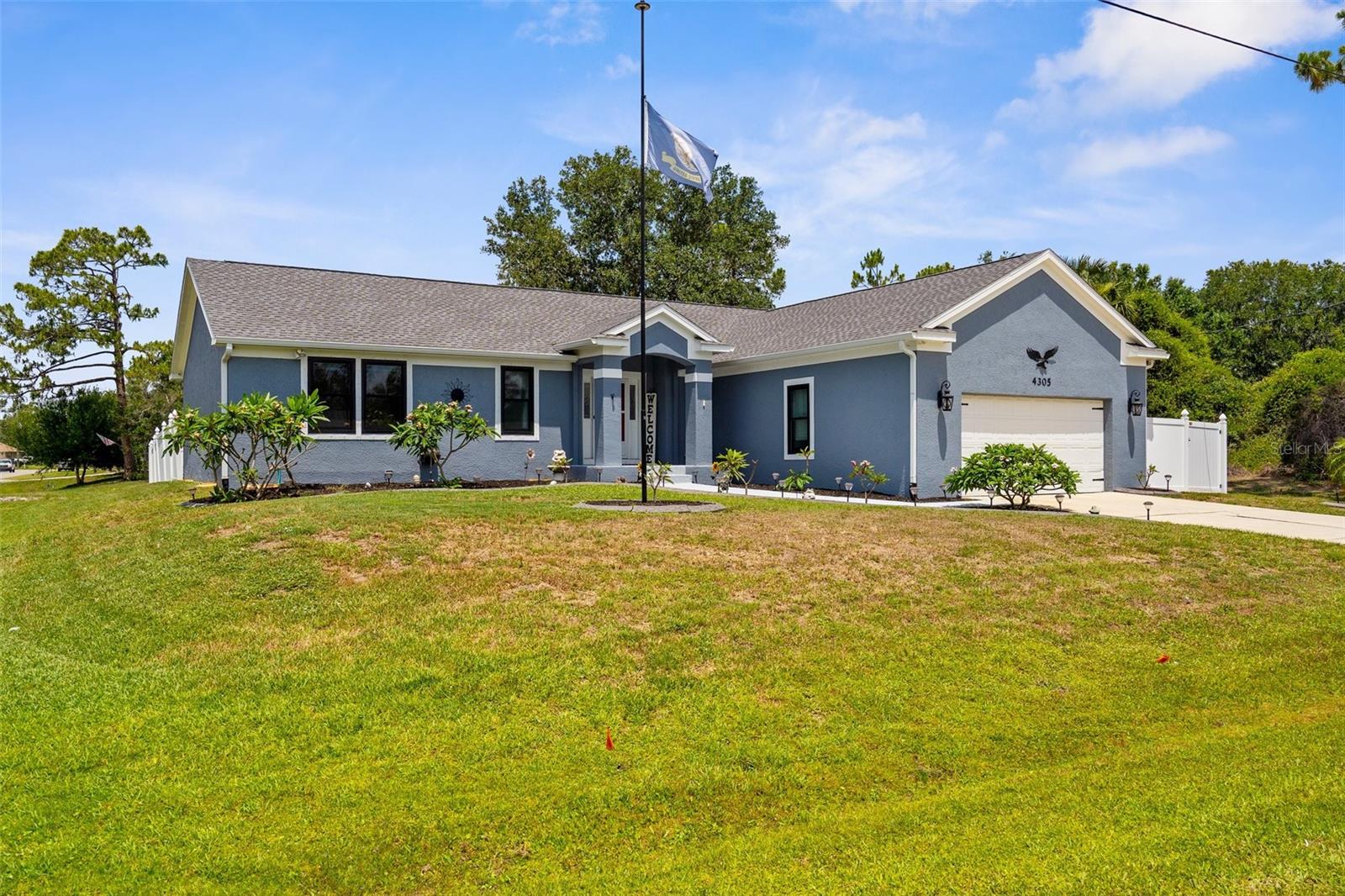 One or more photo(s) has been virtually staged. Back on the market due to financing fell through. Charming Farmhouse-Style Home on Oversized Lot in the heart of North Port Florida! Situated on a fully fenced lot, this beautifully maintained property is one to fall in love with. From the moment you arrive, pride of ownership is unmistakable. Lush landscaping, highlighted by blooming, owner-propagated plumeria plants, sets the tone for the warmth and charm found throughout this home. Step inside to discover a clean contemporary space with subtle farmhouse touches that create a fresh and welcoming vibe. Soaring vaulted ceilings and impact luxury black windows flood the home with natural light, creating a bright and airy ambiance. The newer roof, gutters, and public water connection add peace of mind, while a walk-around attic provides abundant storage rarely found in homes of this style.
The heart of the home—the kitchen—has been tastefully renovated to match the farmhouse aesthetic. You will enjoy Corian countertops, a classic subway tile backsplash, stainless steel appliances, and not one, but two pantry closets for maximum storage. The spacious owner's suite is a true retreat, featuring a wall-to-wall walk-in closet and an en-suite bath with dual vanities, a garden tub, and a separate walk-in shower—perfect for unwinding after a long day. A split floor plan provides privacy, with two additional bedrooms offering ceiling fans, deep closets, and access to an oversize guest bathroom with a tub and two linen closets. Step outside to your newly built deck, ideal for entertaining or simply enjoying the Florida sunshine. With plenty of space for a pool, this backyard is a blank canvas for your outdoor entertainment vision. This home offers convenient access to the vibrant Wellen Park Downtown area—home to Atlanta Braves Spring Training, movies on the lawn, food trucks, and lakefront adventures. You’re also minutes from the Warm Mineral Springs, Coco Plum shopping plaza, top-rated dining, and some of the region’s most beautiful Gulf Coast beaches, including Manasota Key, Venice Beach, and Englewood Beach. Ten minutes to Walmart Neighborhood Marketplace and 7 minutes to Sarasota Memorial Hospital (opening in 2028). Also, easy access to Tampa, Sarasota, Punta Gorda and Fort Myers airports, getting away—or welcoming guests—is a breeze. This home truly has it all!