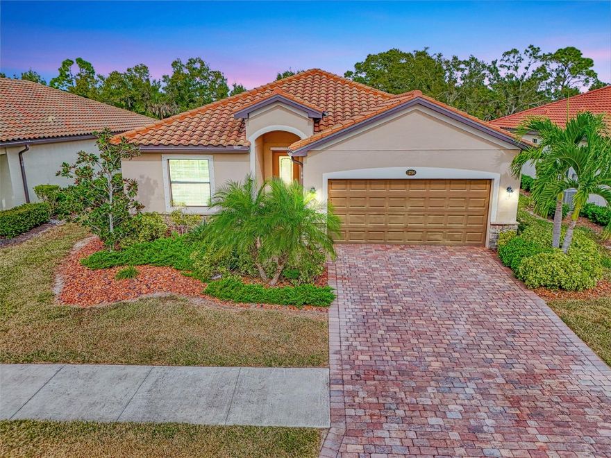 Florida Coastal Dreams- An easy and elegant lifestyle awaits you in the stunning gated community of Gran Paradiso at Wellen Park. This beautifully maintained 3-bedroom, 2-bath single-family home, built in 2019 is in pristine condition and is being offered partially furnished.  Step inside to an open-concept floor plan that seamlessly connects a spacious kitchen and inviting family room—perfect for entertaining or relaxing in style. The oversized primary suite is a true retreat, featuring a spa-inspired en-suite bath with dual sinks, a soaking tub, walk-in shower, and private water closet. Two additional bedrooms provide flexibility for guests, a home office, or a fitness space, complemented by a generous second full bath with direct lanai access. Enjoy serene, wooded views from your screened lanai and a large backyard ideal for pets or simply soaking in Florida’s natural beauty. Gran Paradiso offers peace of mind for seasonal residents and an unmatched lifestyle for full-time homeowners. Indulge in award-winning amenities: a resort-style pool, tennis and pickleball courts, sauna, hot tub, and a state-of-the-art fitness center. Join vibrant community events such as live music, food trucks, and clubs for every interest, or explore nearby downtown Wellen for dining, shopping, and weekly farmers markets.  All of this is just minutes from Sarasota’s world-renowned beaches, championship golf courses, upscale shopping, fine dining, and cultural attractions. Added bonus, recent updates ensure full irrigation access is returning soon—no more water worries!  Embrace the coastal lifestyle in this remarkable community.  This property is not in a flood zone and includes Hurricane window coverings.