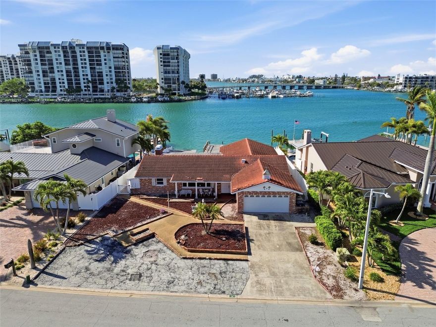 Located on a quiet cul-de-sac on Paradise Island, this 9,518 SF waterfront property with 73-feet of frontage looks south onto Devil’s Elbow with only one bridge to the Gulf. Constructed as a 2,409 SF 4-bedroom, 2-bath home, the property had 6-inches of water affect floors, drywall and electrical after hurricane in 2024 and can either be restored or demolished to build your dream home (existing neighbors have done both). Paradise Island is a highly desirable residential neighborhood known for friendly residents, convenience and tropical charm. Just minutes from the sandy beaches of Treasure Island as well as downtown St. Petersburg with its ongoing cultural events, sports and restaurants. And close by, Treasure Bay Golf & Tennis offers scenic views of Boca Ciega Bay, pickleball, tennis, a par-3 golf course (temporarily closed for an environmental study) and playgrounds—a beautiful intracoastal resource to enhance family living in Paradise Island.  Priced under 2025 appraised value.
