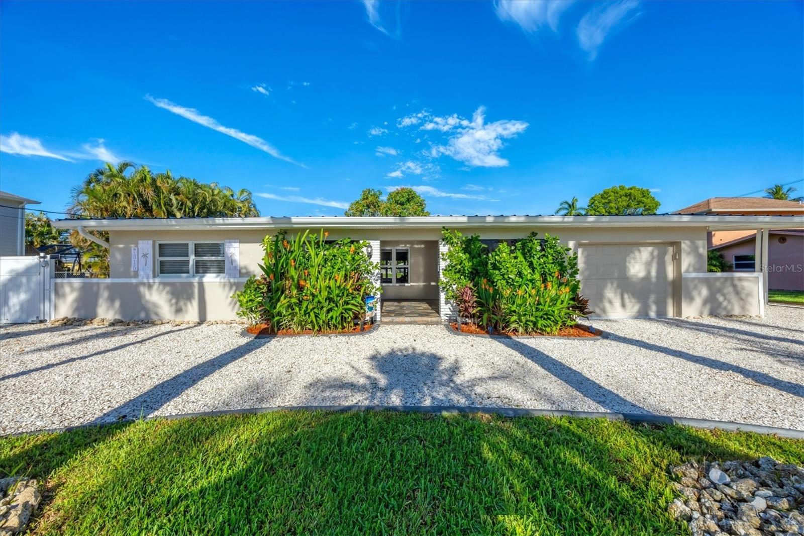 FULLY FURNISHED WATERFRONT OASIS WITH LUXURY UPGRADES – Boat Lift, Pool, Dock, RV Pad & More! Discover coastal living at its finest in this beautifully upgraded, move-in-ready waterfront home just 4 houses from the Caloosahatchee River with no fixed bridges—offering direct sailboat access to the Gulf of Mexico. Every inch of this home has been enhanced for comfort, style, and Florida lifestyle living. INTERIOR FEATURES (Upgraded 2024–2025): New large-frame porcelain floors (2024) for a modern, clean look;navy blue shaker cabinets with quartz countertops and matching bathroom vanity tops (2024); German-engineered tankless water heater (2024) for energy efficiency; built-in closets throughout (2025); and Moen shower and tub fixtures, with semi-frameless glass in the guest bath and frameless in the primary suite. GOURMET KITCHEN & ENTERTAINING: Samsung Bespoke French Door Refrigerator with beverage center & touchless open (2025); 36” Thor professional stove; 42-bottle dual-zone wine cooler; Wet bar with built-in filtration system; high-end Thor appliances installed 2024. OUTDOOR PARADISE: 80-foot dock with: 10,000 lb boat lift, 30/50 amp shore power & water hookups, cleats every 10 feet for large vessels, and a fishing station - live bait tank with filtration; Night lighting and stunning views; 6-ft canal depth at summer low tide – perfect for boating; 100-ft concrete seawall; 4 houses from the river and just a short boat ride to The Boathouse or the Gulf. RESORT-STYLE BACKYARD: Custom saltwater pool (2024) with: PebbleTec finish, glass tile detailing, electric heater, remote-controlled lighting/spa blower, fountain and Pentair VSP energy-efficient pump; 12’x20’ electric awning for poolside shade; firepit, outdoor shower, perfect after a swim or boat day; new irrigation system; landscaped privacy with 45 Areca palms; 15'x15' garden with banana trees, herbs, peppers & tropicals; crushed shell wrap-around driveway; 45-ft RV pad with 50 amp hookup, water & power and a 12 foot access gate. ADDITIONAL HIGHLIGHTS: Impact sliders on both sides of the home (2025); one-car garage with direct home access; large, private front patio with sun shade & lounge seating; custom lighting in both front & back yards; approximately 1.2 miles to I-75 and 5.2 miles to historic downtown Fort Myers. This home is truly one-of-a-kind — perfect for boaters, entertainers, and anyone craving high-end finishes and peaceful waterfront living. Schedule your private showing today and start living the Florida lifestyle!