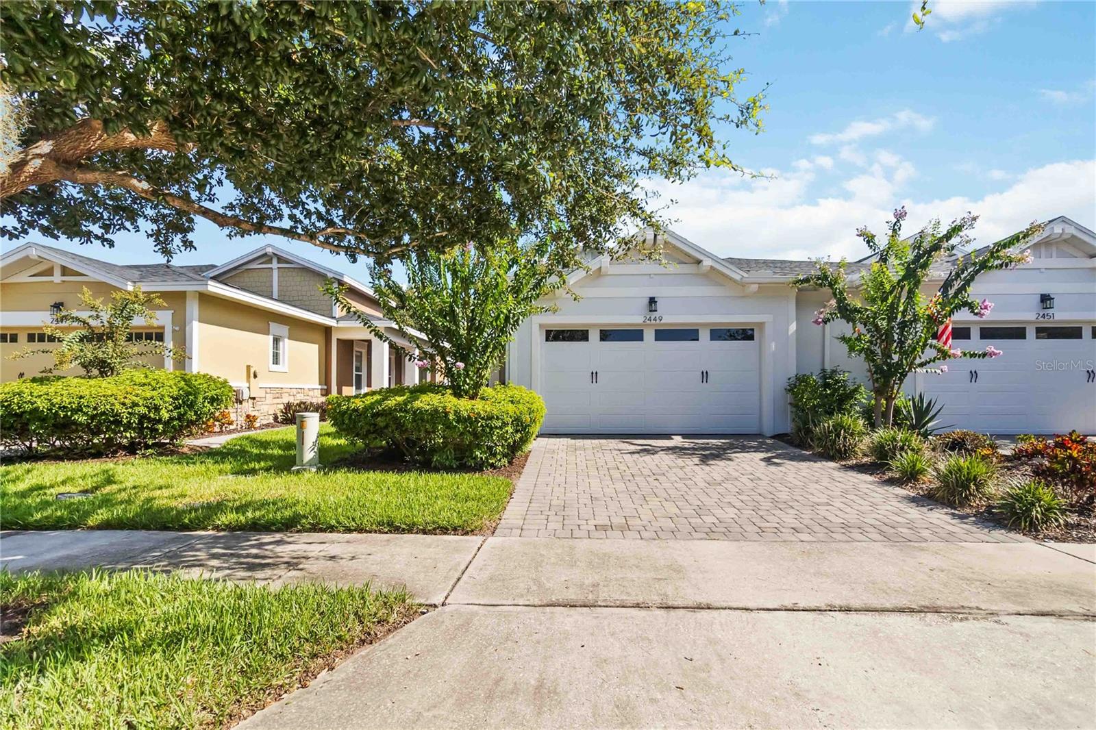 Meticulously kept! Absolutely Beautiful Daytona floor plan located in the well sought after Gated 55+ Active Del Webb Twin Lakes community. Walk into the breathtaking property featuring ceramic tile throughout. Professionally painted, Great Décor. Upgraded kitchen 42" Cabinets, pantry, custom rounded granite countertops, Pendant lights, and chandelier. The living room features a transit window for extra natural lighting. Sliding glass doors lead to Lanai which features a privacy screen on the west side of the lanai that shades the sun, to enjoy your morning coffee or entertaining family and guest. Property is backed to privacy trees. Primary bedroom features a tray ceiling, and ceiling fan with light. The primary bedroom bathroom features custom closet by design shelving, glass shower doors, custom diamond shaped flooring in the shower, and custom tiling. Double vanity granite countertops. Large walk-in closet with closet by design shelving. Laundry room has tailored lower cabinets for great storage. Guest bedroom ceiling fan with light and custom blinds. Property has a newer Rinnai tankless water Heater. 2 car garage features custom paint and upper shelving for storage. Amenities include a Resort style pool, Lap Pool and 3rd pool on the carriage house side, 20,000 square foot Gorgeous Clubhouse, State of the art Fitness Center, Flex room, Tennis Courts, Putting Green, Walking Trails, Pickle Ball Court, Fishing, Kayaks, Pontoon Boats and Jon boat to use on Live Oak Lake! The community has many active and socializing activities. View today!