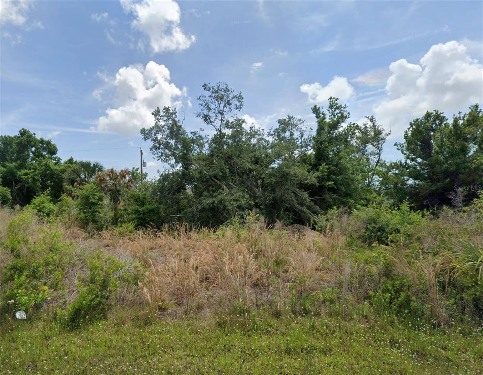 Endless possibilities on Claremont Drive! Ideally situated in Port Charlotte, this property offers flexibility and opportunity. Even better – the adjacent lots are also available, giving you the option to purchase individually or as a package. Perfect for individuals, builders, or investors looking for multiple side-by-side lots! Tee off 1 mile from Claremont at The Cove of Rotonda Golf Center. You’ll also be close to Fishermen’s Village with waterfront dining and boutique shops, festivals, and parades! Port Charlotte Town Center for convenient shopping and restaurants. Spend the day at the new Sunseeker Resort with a day pass to enjoy two resort pools, or stop in for world-class dining, amazing sports bar, Italian, seafood, or the food court without a pass. Outdoor lovers will appreciate quick access to Port Charlotte Beach Park, Stump Pass Beach State Park, public boat ramps, and endless opportunities for paddle boarding and kayaking. Sports fans will love the proximity to Charlotte Sports Park, spring training home of the Tampa Bay Rays, as well as CoolToday Park, the spring training facility for the Baltimore Orioles.
Whether you’re looking to build your dream home, create an investment property, or secure multiple parcels for future development, this opportunity offers location, flexibility, and lifestyle! Adjacent lots available: A4662877, A4662883, A4662885, A4662886.