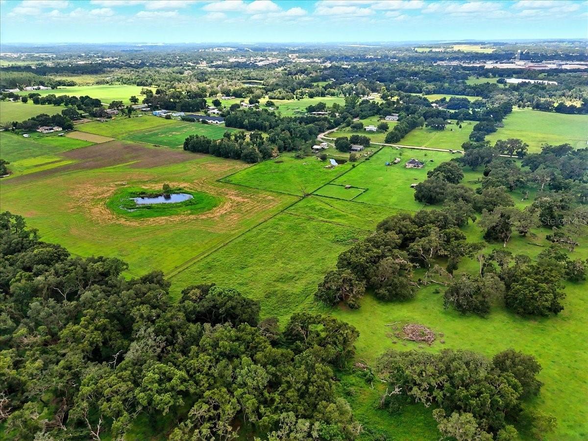 Tired of the cookie-cutter life? Escape the mundane and build your dream home on this 4.96-acre parcel zoned Agricultural Residential (AR) in Dade City. This fully fenced property is cleared, features a mix of pasture and natural water zones, and currently benefits from a Greenbelt/ag exemption. With no HOA and no deed restrictions, there’s room to create your ideal setup—whether that's a custom home, animals, or wide-open space to roam. Conveniently located just minutes from downtown Dade City, but tucked far enough away to enjoy peace and privacy. Freedom, space, and opportunity don’t knock twice—grab the gate and walk through it.