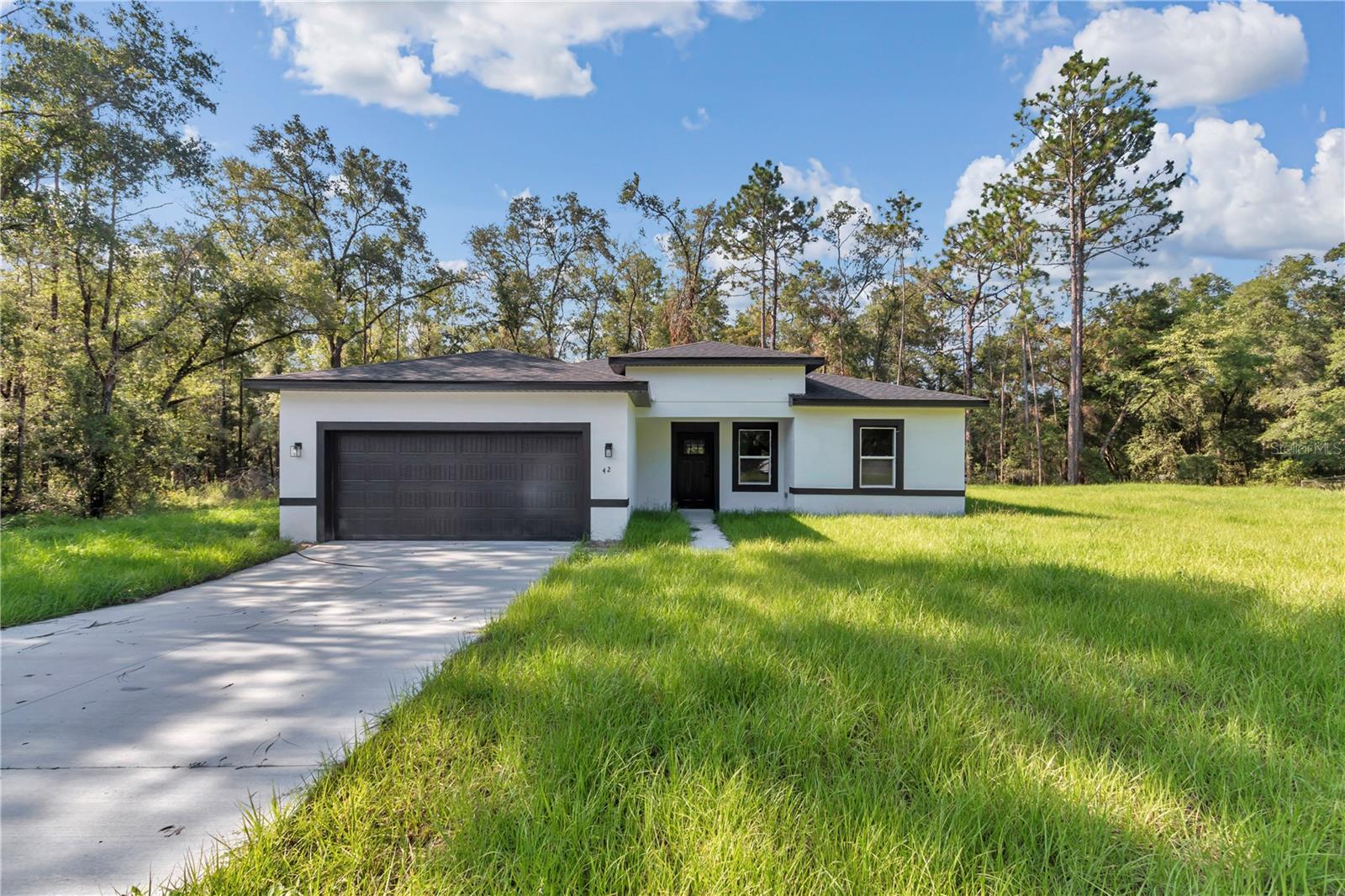 PREMIUM CORNER LOT 0.33 ACRES!! Gorgeous New Construction Home in Citrus Springs – 4 Bedrooms, Prime Location
Welcome to your dream home in the heart of Citrus Springs! This stunning new construction offers the perfect blend of modern design, spacious living, and quality finishes—ideal for families, professionals, or anyone seeking comfort and convenience.
Featuring 4 spacious bedrooms and 2 full bathrooms, this home is thoughtfully laid out with an open floor plan that enhances natural light and flow. The primary suite boasts a luxurious walk-in closet, while the additional bedrooms include built-in closets for smart storage and organization.
The expansive living room and elegant dining area are perfect for entertaining or relaxing in style. You'll love the beautiful kitchen, complete with solid wood cabinets, stone countertops, and included appliances, ready for everyday meals or special occasions.
Additional features include a 2-car attached garage, offering secure parking and extra storage space.
Located in a desirable area of Citrus Springs, this home is just minutes from a main road for easy commuting, and close to highly rated schools, making it an excellent choice for families.
Don't miss out on this incredible opportunity to own a brand-new home in one of Citrus County's fastest-growing communities. Schedule your private tour today!
WASHER AND DRYER INCLUDED!!