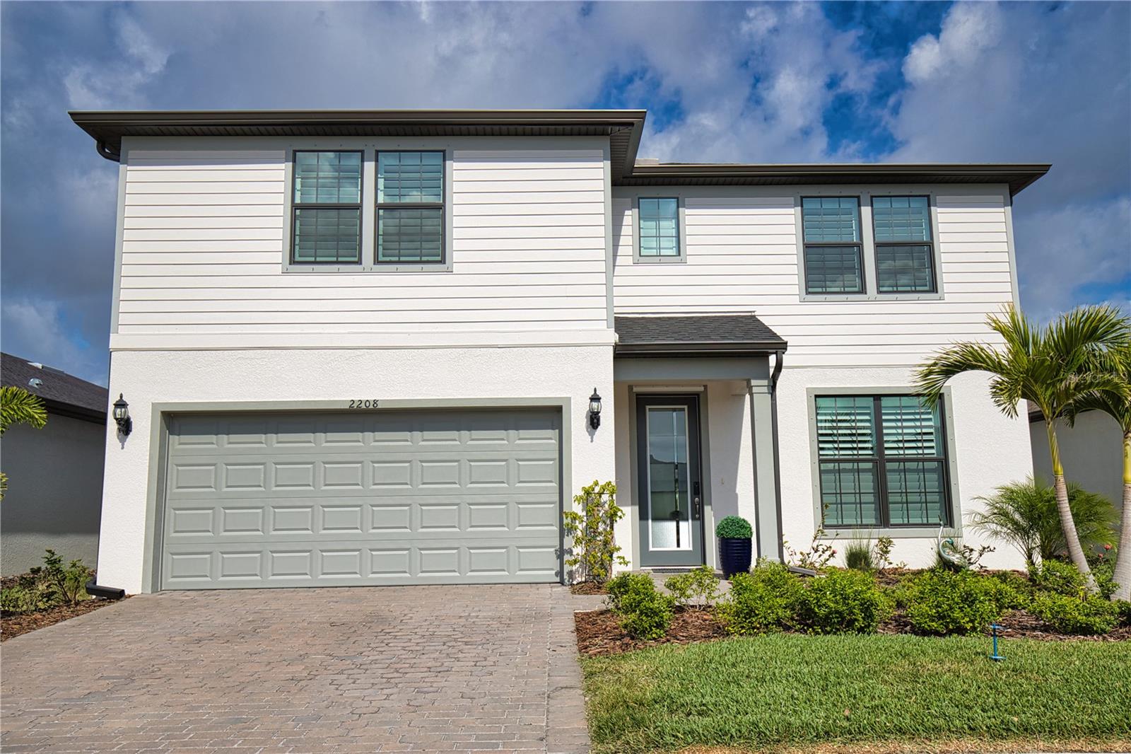 Immaculately maintained 2023-built Whitestone in Cedar Grove with a southwest-facing lanai and screened-in pool! This stunning two-story home features a first-floor owner's suite with a walk-in shower, soaking tub, dual sinks, private water closet, and a spacious walk-in closet. The open-concept kitchen with custom pull out drawers, café, and gathering room create an ideal space for entertaining, while the enclosed flex room offers versatility as a home office, gym, or playroom. Upstairs, you'll find three additional bedrooms, full baths, a generous loft, and oversized closets throughout, providing plenty of storage space. Notable Upgrades: KitchenAid appliances, epoxy-coated garage floor with added shelving, generator transfer switch with outdoor power inlet, plantation shutters, and a fully fenced backyard with privacy fencing and Foxtail palms. Enjoy an exceptional lifestyle with fantastic community amenities, including a sparkling pool, playground, and basketball court—all just steps from your door. With lawn care included in the HOA, your weekends are yours to relax and unwind. Commuters will love the easy access to I-75 via the Toledo Blade exit, and a X flood zone! Don’t miss the opportunity to enjoy upscale living in the highly desirable Cedar Grove community of North Port!