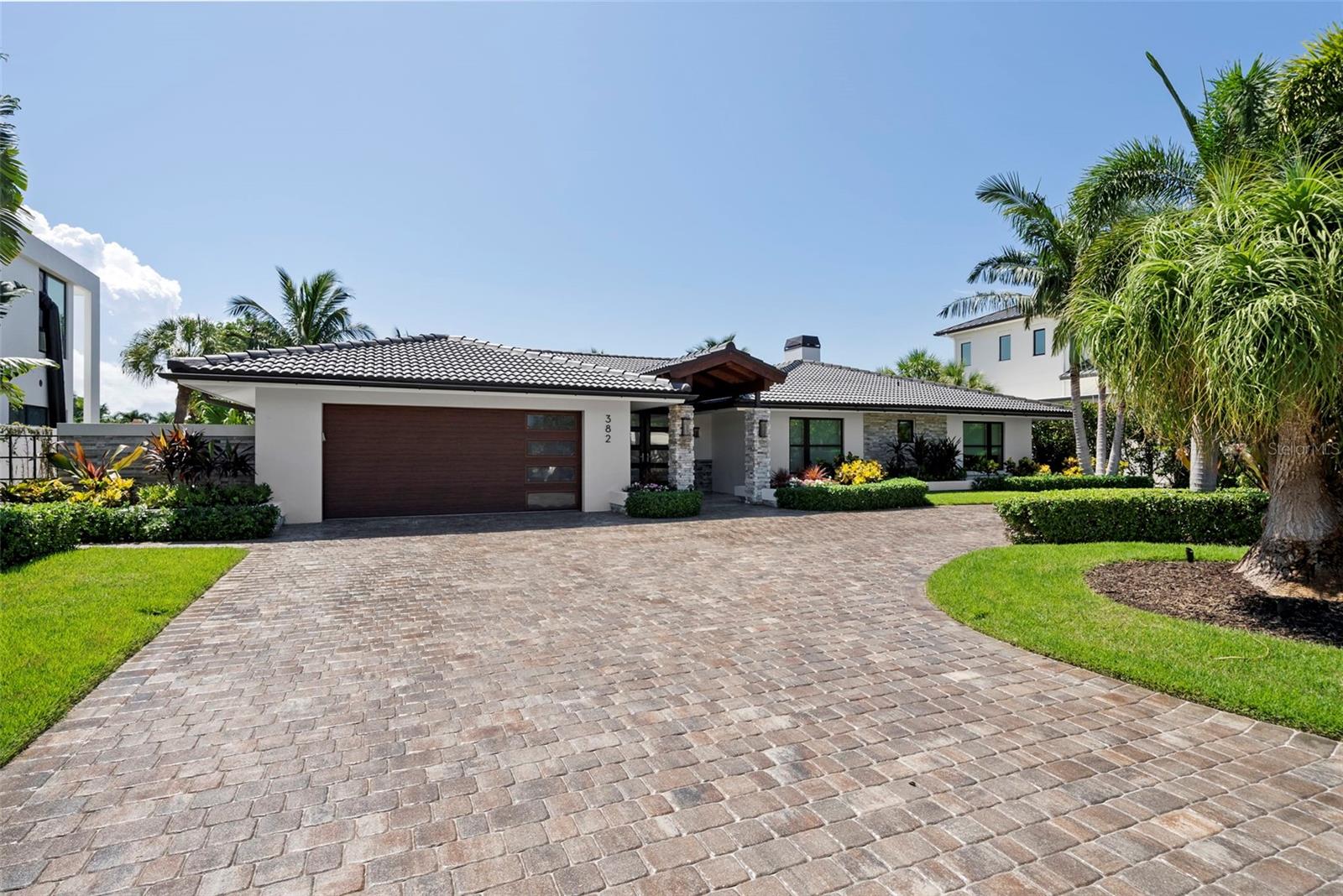 This home was spared from the recent storms. Positioned on one of the highest elevations within Bird Key, this luxurious waterfront residence offers an extraordinary opportunity to experience Sarasota's most sought-after lifestyle. Completely reimagined by Perrone Construction in 2020, this four-bedroom, three-bathroom home was taken down to the studs and meticulously remodeled with a blend of timeless elegance and modern sophistication. New wiring, plumbing, impact glass, spray insulation, and all-new stucco are just some of the extensive updates, ensuring the highest level of craftsmanship and comfort. State-of-the-art audio-video systems further elevate the home’s modern appeal.
Set on a deep-water canal with 100 feet of water frontage, the property features a new dock and platform lift, ideal for the boating enthusiast. A large outdoor living space invites you to relax and entertain, taking full advantage of Sarasota’s year-round sunshine and stunning waterfront views.
The home's elevated position and impeccable condition offer peace of mind, with no flooding issues during recent storms. Bird Key is celebrated for its exclusivity, privacy, and proximity to Sarasota’s world-class dining, shopping, and cultural attractions. This home offers the ultimate waterfront lifestyle in a truly prestigious location. An extensive feature sheet is available upon request.