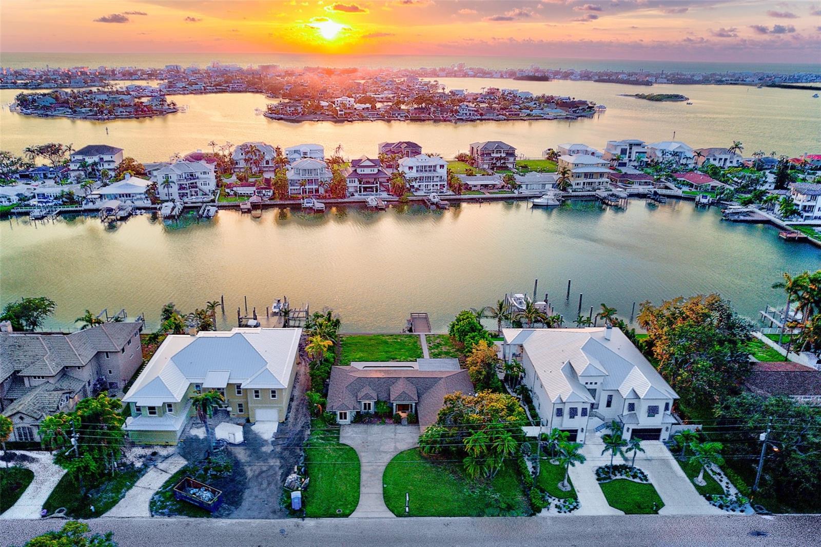 Welcome to your coastal dream home in the prestigious community of Harbor Bluffs. Situated on a wide canal with 100 ft. of water frontage just off the intracoastal waterway. Offering deep, protected water with access to the Gulf, this is a boater’s paradise just minutes from Tampa Bay's award-winning beaches. This residence features 4 bedrooms, 2.5 bathrooms, 2 car garage with an open, spacious layout. The family room with vaulted ceilings opens to the pool area with water views providing the perfect backdrop for outdoor waterfront living. The open kitchen features custom cabinetry, a huge custom island with tons of storage, and thoughtful design details throughout. Wake up to the water—three of the four bedrooms offer direct water views, bringing the outdoors in, creating a tranquil retreat. The primary suite features sliders to the pool area, double vanity with granite countertops, large walk-in closet, linen closet, walk-in glass shower and jetted tub. Laundry room with Bosch washer and dryer. Large heated pool with pavered lanai. Enjoy watching dolphins play and a beautiful sunset from your own private dock. Located just moments from charming local-owned restaurants, coffee shops, boutiques, marinas, tennis and pickleball courts, and a vibrant community scene. This is your chance to own a slice of waterfront paradise in one of Tampa Bay's most well-loved communities.