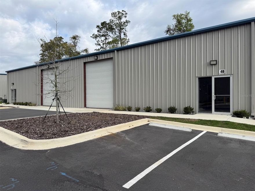 Brand New Warehouses for sale or for lease on busy Hwy 441/301/27/South Pine Avenue in Ocala, Florida. Each building is 5000 sq ft. There are 10 buildings available. Each can be divided in half creating 2500 sq ft spaces. Each 2500 sq ft space has one office and one ADA bathroom and one 14' overhead ground loading door. Property has tractor trailer access with central turnaround and ground unloading. Each space is offered either for lease or for sale as a condo unit.