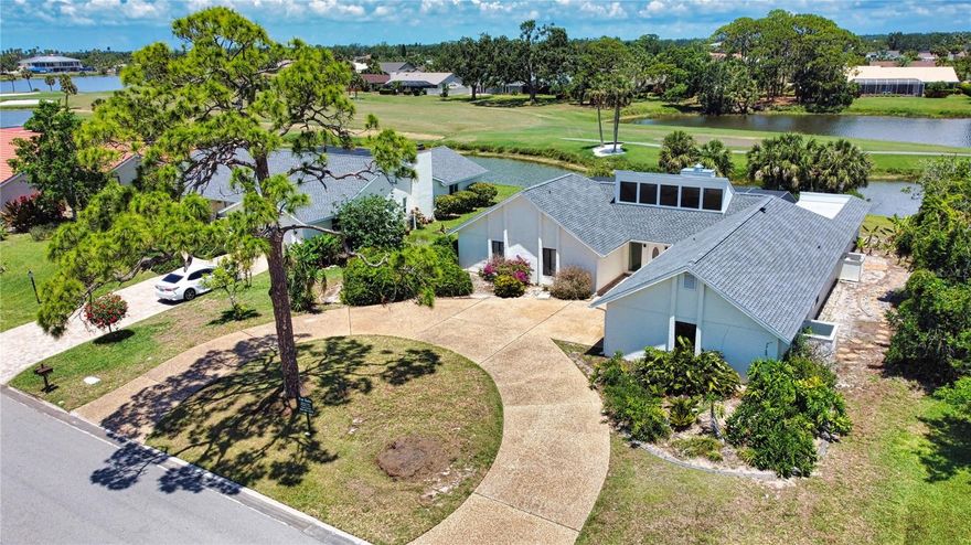 This contemporary 3-bedroom, 2-bathroom pool home, complete with an office and an oversized 2-car garage, sits on a spacious lot in the sought-after, gated community of The Country Club of Sarasota with 24/7 security. A grand circular driveway welcomes you to this elevated property, offering breathtaking views of the lake, lush vegetation, and the golf course where wildlife frequently makes an appearance.
Enjoy the tranquility of the expansive covered lanai, perfect for relaxing and entertaining. Cool off in the generously sized pool, all while taking in the serene surroundings. Inside, solid wood doors and trim enhance the home's warm and inviting ambiance, beautifully complemented by an abundance of natural light. With a brand-new roof installed in January 2025, newer AC, repiped in 2009, this home is as functional as it is comfortable. Seller is motivated.