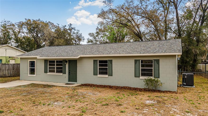 ABSOLUTELY TURNKEY – NEW ROOF, NEW HVAC, AND TOP-TIER FINISHES! Why wait for new construction when you can move into a meticulously remodeled masterpiece today? No detail has been spared in this complete transformation, headlined by a brand-new roof and new HVAC system for total peace of mind. Step onto gorgeous new luxury vinyl plank flooring that spans the entire home, complemented by new interior doors, updated baseboards, and a fresh, modern paint palette inside and out. The heart of the home is a stunning chef’s kitchen featuring solid wood shaker cabinetry, high-end Calacatta Fantasy quartz countertops, and new stainless steel appliances, including a refrigerator and dishwasher. Both bathrooms have been elegantly redesigned with custom-tiled showers featuring premium Moen valves and hardware, accented by all-new designer light fixtures. Enjoy the freedom of NO HOA and the privacy of a fully fenced backyard, perfect for pets, gardening, or entertaining. From the quartz surfaces to the structural upgrades, this home offers the luxury of a custom build with the character of an established DeLand neighborhood. Septic system has been pumped and tested and is good to go! Report available at no cost!