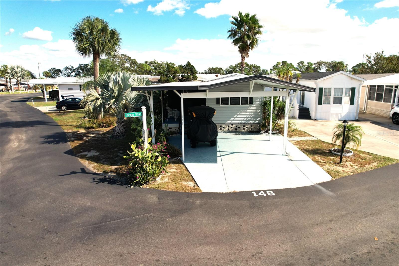 WELCOME TO DEER CREEK RV & GOLF RESORT! Enjoy 55+ RESORT STYLE LIVING in this 1 bedroom, 1 bath park model with Florida Room & porch! This home is in the highly desirable Mockingbird Ridge Community! LOW HOA FEES! Just $145 A MONTH! Spacious corner lot with mature palm trees & the perfect location! Includes an 8 x 10 Shed, Club Car Golf Cart & all the furniture/furnishings! The community offers so many amenities, including a heated pool & cabana area with 2 gazebo’s & a clubhouse with tons of fun activities including pool aerobics, fitness classes & card games to name a few! Enjoy golfing on the 18 Hole Executive Golf Course or shopping at the Pro Shop! The main clubhouse offers a variety of social events throughout the year ~Cardio Drumming, Exercise Classes, County Line Dancing, Crafts, Swing Dancing & more! The Tiki Bar is a great place to meet new friends & listen to live bands & music! Onsite dining is available at Greenside Grill & Buddy’s Snack Shop! Deer Creek is centrally located in Davenport just 20 minutes from Disney & all the attractions that families enjoy! Hop on your golf cart & ride to many restaurants & shops nearby. Posner Park is just minutes away from many stores such as Bealls, Marshalls & Star Bucks! Call today to view this HIDDEN GEM in sunny Florida! Just 1.5 hours to each COAST!