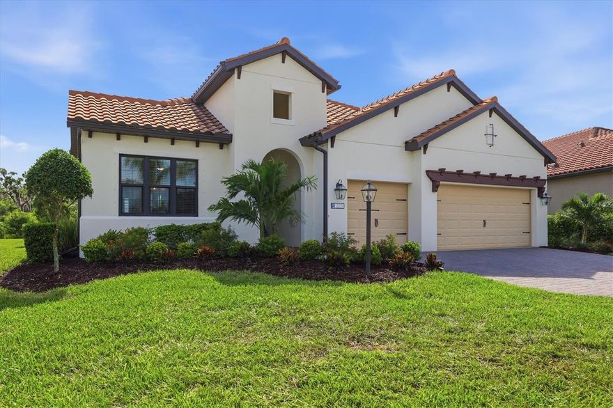 WOW take a look at this move-in ready ''Silver Sky '' floorplan in the coveted fully built out gated community of Indigo! This property is located on a desirable "loop road" AND protected conservation area with rear facing East which will provide beautiful sunny mornings and cooler afternoons! This home boasts a luxurious primary bedroom, one en-suite, 2 guest bedrooms, 3 full bathrooms, den/study, large 3-car garage AND Indigo is a community that has natural gas for each home! The grand foyer with its over eleven-foot-tall ceilings, sets the stage as you focus on the oversized, open spaces enhanced by the home's super-private rear where there is nothing but you and nature! Rest assured your new home is built super strong with concrete block construction, a concrete tile roof and HURRICANE protection for all energy-efficient windows. Additional features include: Brick paver driveway/lanai, gutters, pre-wired for a future pool, Pocket Slider in lanai, custom 8' HURRICANE IMPACT front door, 10' high ceilings throughout with multiple tray ceilings, Integrated surround sound speakers in living room, cushion close cabinets throughout, premium ceramic tile throughout (NO carpet), LED recessed lighting, 8-foot-tall interior/exterior doors, 5 1/4" deco baseboards and more! The heart of this home is the stunning, designer-inspired kitchen, a true showpiece that blends warmth and sophistication with everyday functionality. This chef inspired space features a built-in microwave and convection oven, 5 burner induction cooktop with a builder-grade gas line below staged for any future gas cooktop, premium wooden cabinetry with crown molding, slow close cabinets, matching stainless steel appliances with a custom stainless steel exhaust hood and LED under cabinet lighting that complements the high level granite countertops and premium porcelain backsplash. The oversized island is the focal point expansive enough to comfortably seat six or more guests, making it the perfect gathering space for family dinners, holidays, or casual mornings with coffee. Your new luxurious primary bathroom boasts two walk-in closets, two separate vanities, high level granite counters, water-closet & large walk-in shower with single raised window that provides an abundance of natural sunlight. The oversize garage has an insulated HURRICANE IMPACT garage door and more than enough space for your vehicles, toys and storage! Open the large pocket sliders out to your paver rich lanai where you will be AMAZED at not only the undisturbed preserve views (NO neighbors) but also an abundance of deck space, a builder-grade gas stub, electrical and plumbing ready for any future kitchenette! Indigo is an active community featuring a full-time on-site manager and a full-time activities director who manages an extensive calendar of activities for all ages. A-Rated Gullett Elementary AND Mona Jain Middle school are right outside our gates too! You can also expect sidewalks on both sides of the street, resort style heated community pool/spa at the main clubhouse where you will find 5 cabanas with an abundance of seating, 4 pickleball courts, 2 bocce ball courts, 24-hour exercise gym, meeting room/banquet room and playground.