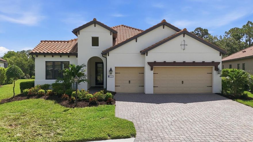 WOW take a look at this move-in ready ''Silver Sky '' floorplan in the coveted fully built out gated community of Indigo! This property is located on a desirable "loop road" AND protected conservation area with rear facing East which will provide beautiful sunny mornings and cooler afternoons! This home boasts a luxurious primary bedroom, one en-suite, 2 guest bedrooms, 3 full bathrooms, den/study, large 3-car garage AND Indigo is a community that has natural gas for each home! The grand foyer with its over eleven-foot-tall ceilings, sets the stage as you focus on the oversized, open spaces enhanced by the home's super-private rear where there is nothing but you and nature! Rest assured your new home is built super strong with concrete block construction, a concrete tile roof and HURRICANE protection for all energy-efficient windows. Additional features include: Brick paver driveway/lanai, gutters, pre-wired for a future pool, Pocket Slider in lanai, custom 8' HURRICANE IMPACT front door, 10' high ceilings throughout with multiple tray ceilings, Integrated surround sound speakers in living room, cushion close cabinets throughout, premium ceramic tile throughout (NO carpet), LED recessed lighting, 8-foot-tall interior/exterior doors, 5 1/4" deco baseboards and more! The heart of this home is the stunning, designer-inspired kitchen, a true showpiece that blends warmth and sophistication with everyday functionality. This chef inspired space features a built-in microwave and convection oven, 5 burner induction cooktop with a builder-grade gas line below staged for any future gas cooktop, premium wooden cabinetry with crown molding, slow close cabinets, matching stainless steel appliances with a custom stainless steel exhaust hood and LED under cabinet lighting that complements the high level granite countertops and premium porcelain backsplash. The oversized island is the focal point expansive enough to comfortably seat six or more guests, making it the perfect gathering space for family dinners, holidays, or casual mornings with coffee. Your new luxurious primary bathroom boasts two walk-in closets, two separate vanities, high level granite counters, water-closet & large walk-in shower with single raised window that provides an abundance of natural sunlight. The oversize garage has an insulated HURRICANE IMPACT garage door and more than enough space for your vehicles, toys and storage! Open the large pocket sliders out to your paver rich lanai where you will be AMAZED at not only the undisturbed preserve views (NO neighbors) but also an abundance of deck space, a builder-grade gas stub, electrical and plumbing ready for any future kitchenette! Indigo is an active community featuring a full-time on-site manager and a full-time activities director who manages an extensive calendar of activities for all ages. A-Rated Gullett Elementary AND Mona Jain Middle school are right outside our gates too! You can also expect sidewalks on both sides of the street, resort style heated community pool/spa at the main clubhouse where you will find 5 cabanas with an abundance of seating, 4 pickleball courts, 2 bocce ball courts, 24-hour exercise gym, meeting room/banquet room and playground.