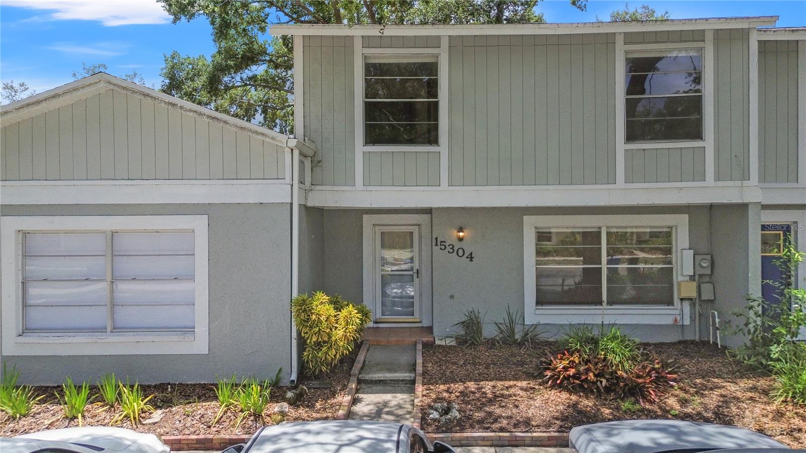 One or more photo(s) has been virtually staged. Enjoy the quiet of this lakefront home along with the convenience of being close to everything. Observe a variety of Florida's spectacular wildlife from the screened and covered back lanai of this 3 bedroom 1.5 bath townhome in a pool community. Play all day on the community pickleball, tennis and basketball courts followed by a dip in the refreshing pool. The kitchen has granite counter top and solid wood counters. The downstairs floors are covered in ceramic tile while the upstairs floors have beautiful hardwood. This fabulous place is in the Freedom High School district. The AC is newer (2022) which should keep you cool and help with your electric bills