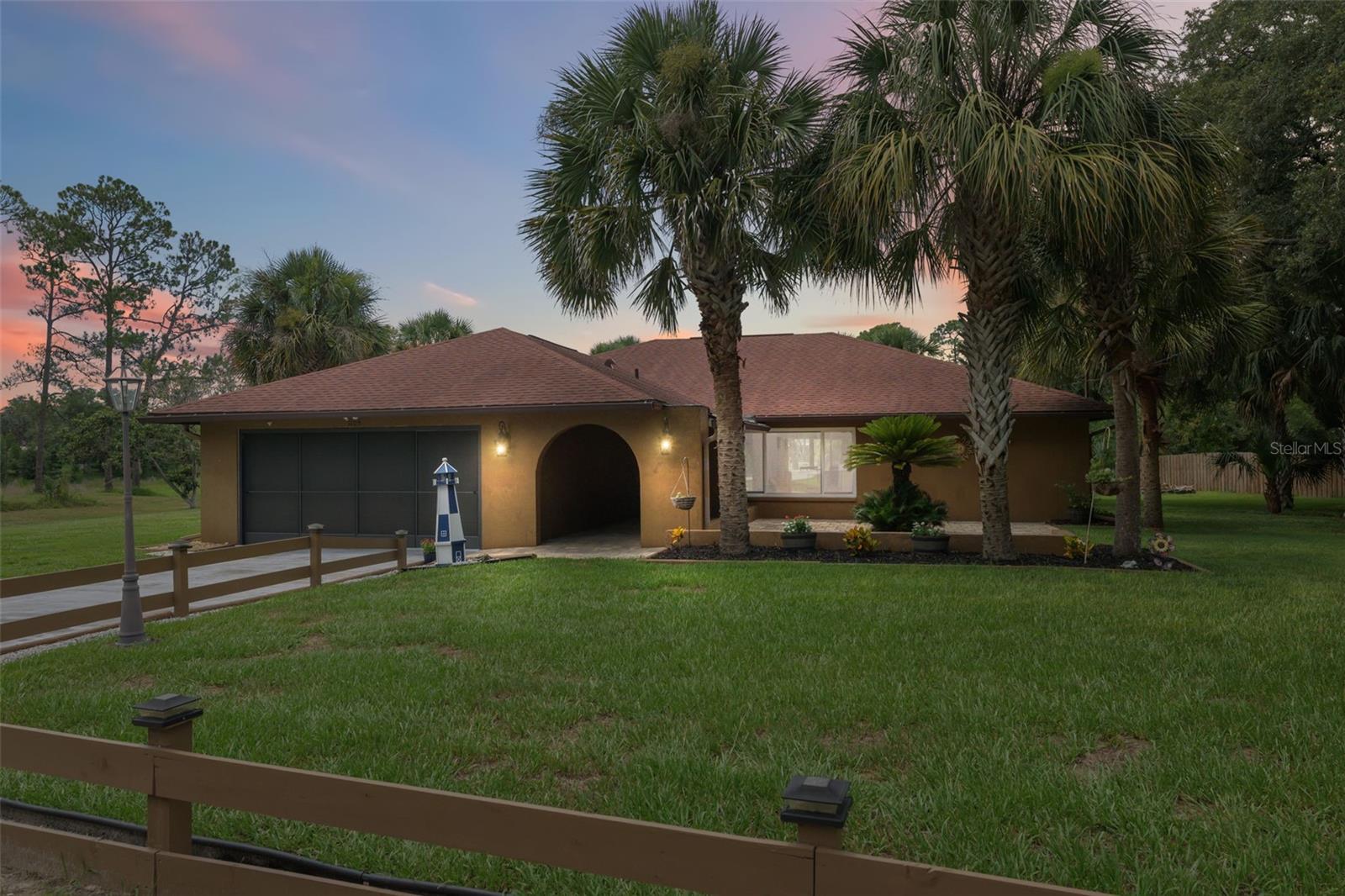 Tucked away on an oversized lot just under half an acre, this beautifully maintained home offers the perfect blend of privacy, functionality, and comfort. A covered front walkway with an extended patio sets a welcoming tone as you step into the heart of the home, where cathedral ceilings and brand-new wood-look vinyl flooring create an open, airy feel in the main living area. The newly updated kitchen is both stylish and practical, featuring new granite countertops, a breakfast bar for casual meals, a tray ceiling, a wall of cabinetry with pantry storage, a double sink, recessed lighting, and a layout that opens into a spacious area perfect for dining, relaxing, or gathering with loved ones. This versatile space is lined with windows and brand-new sliding glass doors that frame the sparkling screened-in pool and let in an abundance of natural light. Step outside and enjoy the fully screened-in lanai, complete with ceiling fan, paver flooring, and a full outdoor kitchen with gas stove and sink—ideal for entertaining or winding down as you overlook peaceful undeveloped land. The pool area features a saltwater conversion, recently re-sealed deck, new pool motor, pool heater with chiller, and plenty of room to relax. The primary bedroom is a true retreat with private pool access and an ensuite bathroom dressed in crisp, clean white finishes. One of the two additional bedrooms includes elegant crown molding and dual closets, while the second bathroom also features crown molding and a tub/shower combination. The home has brand-new double-pane windows throughout, and all interior doors have been replaced, adding both efficiency and aesthetic appeal. A shed in the backyard offers extra storage, while the two-car garage provides ample space for parking or projects—and the garage refrigerator conveys with the sale. Additional peace of mind comes from the brand-new drain field, recently installed to ensure long-term reliability. Located just 6.8 miles from Weeki Wachee Springs State Park—where you can kayak, paddleboard, or watch live mermaid shows—7.5 miles from Hernando Beach for waterfront dining and Gulf access, and only 8.9 miles to shopping and restaurants at Nature Coast Commons. For commuters or weekend adventurers, the Suncoast Expressway is just 6.5 miles away, offering a fast and easy route to Tampa and surrounding areas. This home invites you to settle in, stretch out, and enjoy the Florida lifestyle in a space that's move-in ready and thoughtfully upgraded throughout.