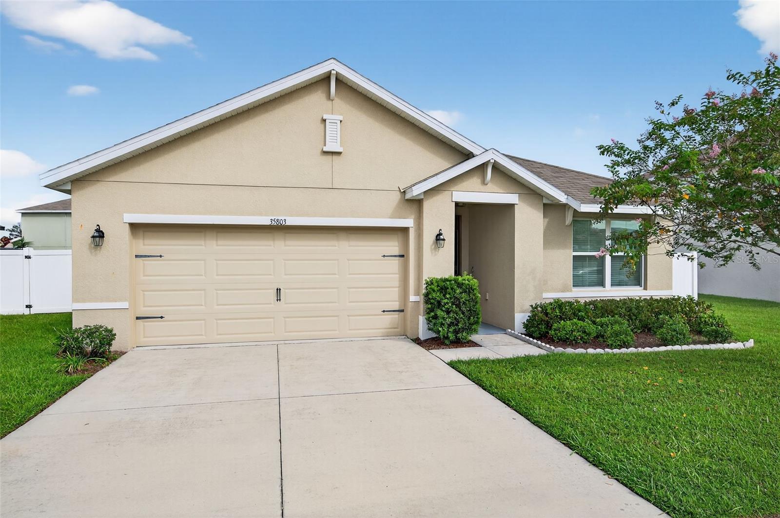 Absolutely GORGEOUS and TURN-KEY, this light and bright 3 bed, 2 bath SPACIOUS home is better than new! As you approach the home, you’ll immediately notice that it has received the best of care. Beautifully landscaped and IMMACULATELY KEPT inside and out, this TURN-KEY gem of a home may just be THE ONE. With almost 1,700 sq ft, an OPEN LAYOUT, TALL ceilings, and a SPLIT FLOOR PLAN, this home would be the PERFECT STARTER HOME or just right if you’re looking to downsize. With absolutely NO CARPET, you’ll love the easy maintenance of the updated 18-inch CERAMIC TILE flooring throughout. The WIDE ENTRYWAY leads past the secondary bedrooms and hall bath to the large living area, kitchen, and dining area. The kitchen is just STUNNING, offering a shining STAINLESS FRENCH-DOOR REFRIGERATOR, a LARGE PANTRY, range, microwave, and dishwasher. The primary suite boasts a generously-sized bedroom, DOUBLE CLOSETS including a WALK-IN CLOSET, double sinks, a water closet, and a large WALK-IN SHOWER. As you walk to the back of the home, you’ll appreciate the sliding glass door with its maintenance-free built-in blinds leading you to the COVERED BACK PORCH, complete with overhead light and ceiling fan. You’ll especially love the SPACIOUS BACK and SIDE YARDS which are COMPLETELY FENCED IN and include 2 lemon trees, an avocado tree, and space for a garden! The Zephyr Ridge Community has a LOW HOA of only $144 a year and offers a beautiful community pool and patio area! This home is ideally located – close to SR 56, I-75, Avalon Park, the Shoppes at Wiregrass, Restaurants, Dining, and more! Schedule your showing today!