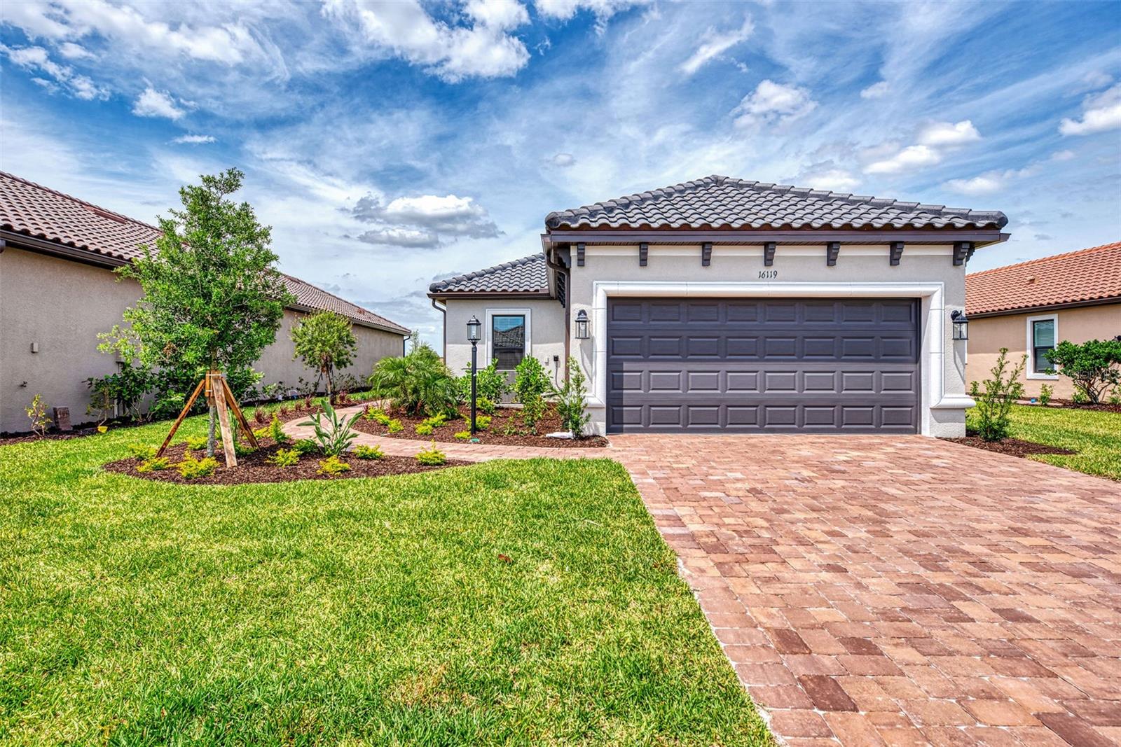 AVAILABLE for short term or annual rental. Welcome to this brand new, never-lived-in villa nestled in the serene, gated vibrant community of Esplanade at Azario in Lakewood Ranch where luxury meets convenience. This elegant and modern 2-bedroom/ 2-bath home with 2 car garage offers a spacious great room and den, providing the perfect blend of comfort and sophistication. This home has been professionally decorated by Katie Brandt Interiors. Upon entering, you are greeted by an open floor plan that seamlessly flows from the living area to the dining space, creating an inviting atmosphere for entertaining or relaxation. There are lots of windows with coffered ceilings in the living room and Master suite which makes this home feel open and light and brings the outside in. The designer kitchen boasts sleek, modern stainless-steel appliances, quartz countertops with ample counter space, making meal preparation a delight. The master suite offers a walk-in closet and a delightful bay window overlooking the lake. The master bath offers dual sinks with quartz countertops, vanity, and expansive walk-in shower. On the other side of the home is the 2nd bedroom with walk-in closet and full bath with quartz countertops. The den offers a pull-out queen sofa bed which can serve as an extra bedroom for guests. The inside laundry room provides plenty of storage space along with laundry sink. Step outside to the screened lanai, where you can savor tranquil moments with a cup of coffee or a good book, surrounded by the lush landscaping and gentle Florida breezes with a lake view. The property's large lot provides ample space for outdoor enjoyment. There is a golf membership that is included with the rental, and you are walking distance of the golf pro shop and the Bahama pool and clubhouse. Located within a gated community, residents of this exquisite villa have access to the clubhouse, state-of-the-art fitness center, resort-style pool, tennis and pickleball courts, 18-hole golf state-of-the-art golf course including a water driving range, offering a myriad of recreational and leisure opportunities. With its modern design, spacious layout, and access to a host of amenities, this rental offers the perfect blend of elegance and comfort making this delightful villa at 16119 Fortezza Drive a rare opportunity for those seeking a tranquil and luxurious lifestyle in Lakewood Ranch. Short Term Rental Rates: May-Oct $4900 plus $300 monthly utilities surcharge; Nov-Dec $6000 plus $300 monthly utilities surcharge; Jan-April $8500 plus $300 monthly utilities surchage; Annual Rental $4900 monthly and tenant pays all utilities. COME SEE THIS HOME TODAY.