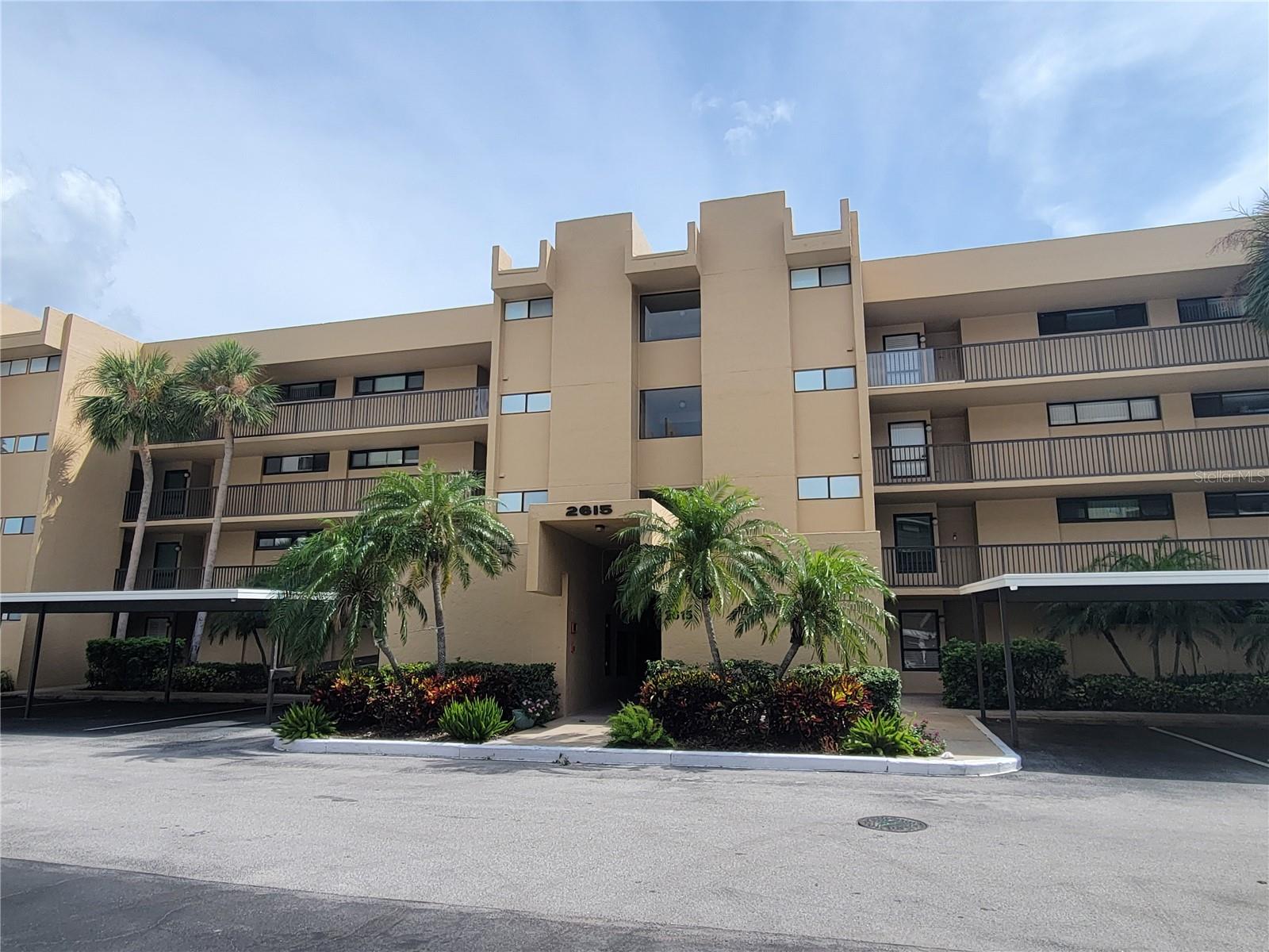 All Ages-Resort lifestyle for annual rent. Spacious 2bed/2bath end unit condo with spectacular golf course & pond views views. Primary suite has a walk in closet and ensuite updated full bath with walk-in shower. Updated kitchen, ceiling fans throughout, screened balcony overlooking a relaxing pond. Full sized washer and dryer in your own private laundry room with generous extra storage space. Elevator, covered parking and plenty of guest parking available. This building is closest to the exclusive pool and rec center for ONLY village 1 residents. Heated pool, spa, gym with sauna. Large rec room with library, kitchen,pool tables and more. Cove Cay is green and lush with golf course and views of Tampa Bay and 24 hr gated security. The golf course is open to the public, you can enjoy the Bayview Grill restaurant. Also on site is a marina with rentals of kayaks, jet skis and boats. Background checks & screening and application fee. No Pets & No Smoking.