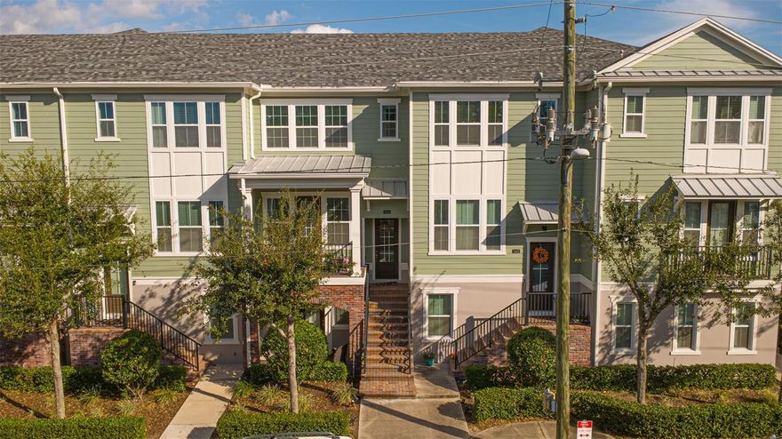 Welcome home to this stunning three-story townhome located in the desirable Enclave at Altamonte community in Altamonte Springs, Florida. Designed for both comfort and privacy, this residence offers three spacious bedroom suites, each featuring its own private bathroom and walk-in closet—ideal for families, guests, or a flexible lifestyle.

A charming brick staircase welcomes you inside and leads to the main living space on the second floor. Upon entering the foyer, you’ll immediately notice the beautiful laminate wood flooring that flows seamlessly throughout all three levels (with tasteful tile in the bathrooms). This level features a large coat closet, a bright and open living room with access to a private balcony, a convenient half bathroom, and a well-appointed kitchen and dining room combination.

The kitchen is a true highlight, boasting a wall of windows that floods the space with natural light. It is equipped with wood cabinetry, stainless steel appliances, recessed lighting, a subway tile backsplash, quartz countertops, a large closet pantry, and a center island with bar seating, perfect for entertaining or casual dining.

Upstairs on the third floor, you’ll find the primary bedroom suite, complete with a generous bathroom featuring dual sinks and a sleek, modern shower. The laundry closet with washer and dryer is conveniently located on this level, along with an additional bedroom suite with its own en-suite bathroom.

The first floor offers a private bedroom suite with an en-suite bathroom and direct access to a private patio, providing a perfect retreat for guests or a home office setup. At the rear of the townhome, enjoy the convenience of a large two-car garage and driveway.

Residents of Enclave at Altamonte enjoy access to community amenities including a pool and playground, all while being conveniently located near supermarkets, Altamonte Mall, and a variety of dining and entertainment options. This home offers the perfect blend of style, functionality, and location—don’t miss the opportunity to make it yours.