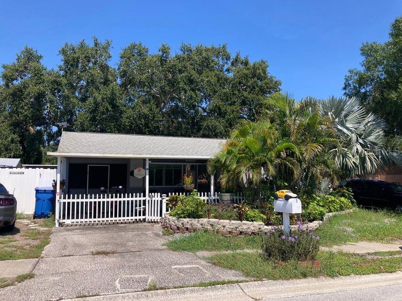 2 Bedroom/2 Bathroom home in desirable Palm Harbor neighborhood. Situated on a street near the end of a cul-de-sac this home is in a great location, convenient access to US 19. Covered front porch for enjoying morning coffee. Large back patio for year round use. The backyard is a tropical oasis. Living dining combination with a cozy open kitchen. Keep your car out of the sun inside the 1 car garage. The home is currently occupied so please do not approach without an appointment.