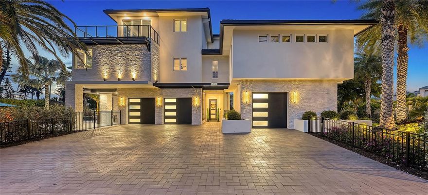 Under contract-accepting backup offers. Discover an unparalleled level of opulence and style in this extraordinary Longboat Key residence, a rare jewel recently reborn in 2022 into a modern masterpiece. Nestled on the coveted Gulf side, just steps from the beach, this custom rebuild is a testament to luxury living without compromise, where no detail has been spared and every facet, from the white oak flooring, handcrafted stone elements and LED accent lighting to the convenience of automated Hunter-Douglas Pirouette window treatments and more, reflects an unwavering commitment to excellence. Upon entry, you’ll immediately notice how meticulous craftsmanship meets sophisticated design. Ascend the in-home elevator to all levels, as the 2nd floor is designed for entertaining with a living room boasting an ambient electric fireplace, a bar with a wine refrigerator and 3 guest BRs with 3 full bathrooms. The kitchen is an absolute showplace, accentuated with sunset views over the Gulf, an oversized center island, an abundance of bespoke low-profile cabinetry including a built-in Miele coffee bar and a custom wrought iron backlit glass feature cabinet, elegant Fine Art lighting, Viking appliances including 6 burner induction stove with knobs, stately glass panels and more. French doors open to the balcony, where a bar-height table sets the scene for soirees of any size. The 3rd floor is dedicated to the primary suite, a sanctuary of tranquility with sliders out to the wraparound balcony that unveils panoramic views of the Gulf of Mexico. The master bath is a haven of indulgence, adorned with his and hers vanities and rain showers. A spiral staircase leads above to the rooftop lounge, a perfect vantage point for 360-degree views of the Gulf and bay. Venture down the spiral staircase from the main living area to a private oasis featuring a heated and chilled pool with a sun shelf and spa, and a contemporary designed covered area to watch tv or to break from the sun. The Elan/Nice smart home system adds a touch of modernity, ensuring your home is as intelligent as it is beautiful. Completing the allure are hurricane-impact windows and doors, full home generator, and the voluminous 3-car garage with abundant storage, in which the 3rd car space can be air-conditioned and repurposed as a gym or office. The property, enveloped by lush tropical landscaping, exudes an air of exclusivity, making it feel like a private resort. Bedroom Closet Type: Walk-in Closet (Primary Bedroom).