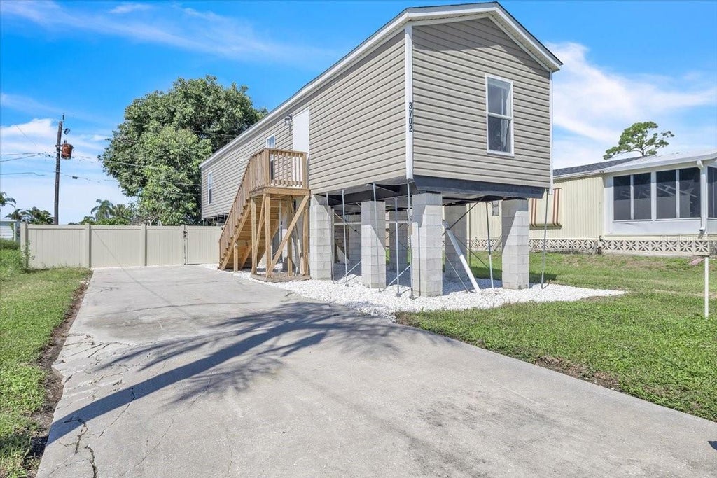 Photo of 3702 Dunreath Road, Port Charlotte, FL 33953 (MLS # C7529463)