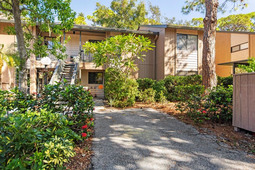 This condo has abundant light from extra side windows and oversized sky-lights that greet you, complete with luxury vinyl floors, crown molding and new electrical panel. The kitchen is stunning and spacious with granite countertops, wood cabinets, wall pantry and spacious prep area.  Other condo improvements include AC, hot water heater (2018), electrical box (2023), new stainless-steel appliances and filmed slider windows of privacy. Both baths are smartly updated with newer vanities and tile, and glassed-in showers. Outside living and bay breezes are enjoyed within the enclosed tiled lanai, with glassed and screened sliders.  This tropical waterfront neighborhood has its own botanical gardens, bird sanctuary, and a lifestyle with resort amenities: 86 boat slips; 3 clubhouses; 6 heated pools, tennis courts, fitness, trails, kayaking, fishing, and classes and clubs offered at "Pelican Cove University." Own your own piece of paradise - just minutes from Siesta Key Beach, restaurants, shopping, theaters, and cultural venues of Sarasota.