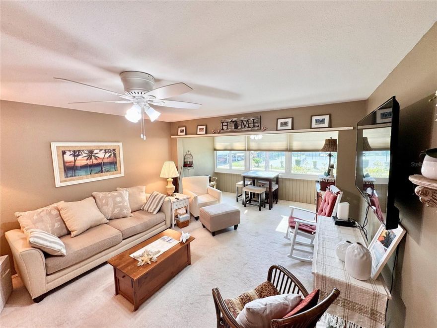 Fully turnkey and tastefully furnished 2-bedroom, 2-bath condo in the desirable Charlotte Square 55+ community. Located on the second floor near the convenient side stair entrance, this building also features an elevator for easy access. Inside, you’ll find a bright, open layout with a combined living and dining area that feels spacious and comfortable. The Florida room offers a relaxing spot overlooking the tennis and pickleball courts—perfect for enjoying the peaceful setting of the community. Recent updates include impact windows (2024), A/C (2024), water heater (2021), newer carpeting throughout with brand-new carpet in the primary bedroom (2025), updated ceiling fans, plantation-style bi-fold closet doors, and new cellular shades on all windows. Charlotte Square offers a wide range of amenities including a two heated pools, tennis courts, pickleball, bocce ball, shuffleboard, and a BBQ area. Conveniently located in the Medical District, you’re just minutes to shopping, dining, the library, and the Port Charlotte Beach Complex for boating, fishing, and waterfront enjoyment. Just bring your toothbrush and clothes—everything else is ready for you.