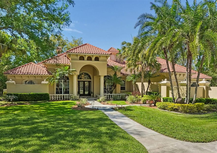 One or more photo(s) has been virtually staged. Situated inside Avila Golf & Country Club, Tampa Bay's most private and prestigious guard-gated community, this rare one-story residence offers the perfect blend of elegance, comfort, and convenience. Set at the end of a quiet cul-de-sac with peaceful pond views, the home features solid construction and the ease of true single-level living. High ceilings, updated finishes, and ceramic flooring throughout create a timeless and inviting atmosphere. Avila's central location places you within minutes of top shopping, dining, major highways, and is zoned for the highly coveted, highly rated Steinbrenner High School. The screened pool and spa area, enhanced by a spacious outdoor kitchen, provides the ideal space for relaxing or entertaining year-round. A serene and well-appointed retreat in one of Tampa's most sought-after communities. Must see in person to appreciate.