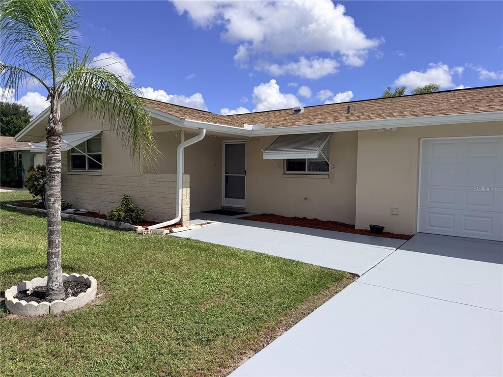 Photo of 10118 Holly Drive, Port Richey, FL 34668 (MLS # TB8552719)