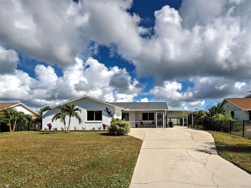 Photo of 6749 Gasparilla Pines Boulevard, Englewood, FL 34224 (MLS # D6145019)