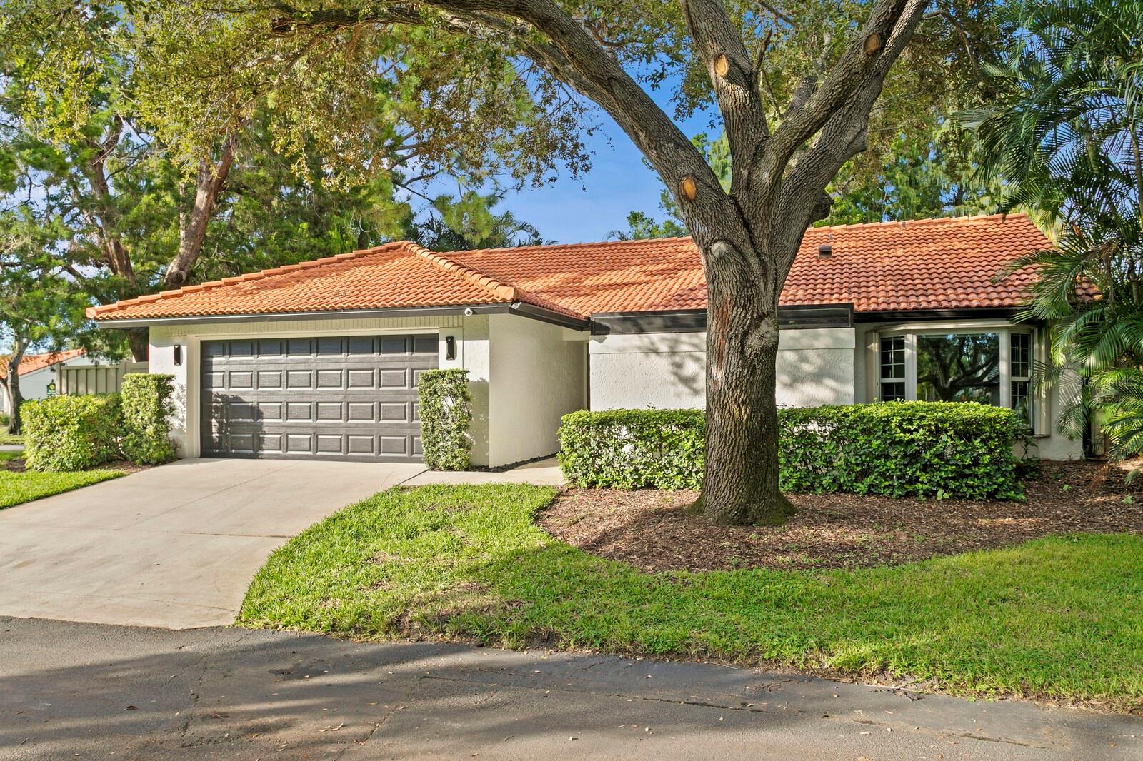 LAKEFRONT SANCTUARY - SOPHISTICATED & TRANQUIL ELEGANCE IN EXCLUSIVE GATED COMMUNITY OF PLACIDO BAYOU | Welcome to this meticulously renovated 3-bedroom, 2-bath split floor plan home nestled within the prestigious gated community of Placido Bayou in St. Petersburg. This exceptional residence sits gracefully on a desirable corner lot overlooking one of the most unique lakefront locations of all St. Pete. You will immediately be enamored with the private, Florida park-like serenity that will flow over you as soon as you enter the foyer and look to the rear wall of glass sliders. Showcasing designer finishes and carefully curated details that elevate it far beyond typical renovations, every element has been thoughtfully selected and executed with both sophistication and warmth in mind, creating a truly distinctive home in one of the only two gated communities of St Petersburg.
The interior captivates with brand-new engineered hardwood flooring that flows seamlessly through the main living areas, enhanced by soaring vaulted ceilings that invite abundant natural light throughout. All new designer lighting has been installed throughout including the living room to amplify the vaulted ceilings. The heart of the home features a stunning kitchen equipped with solid wood cabinetry, premium stainless steel appliances including a 36” KitchenAid gas range and oversized built-in double Thor refrigerator/freezer, a built-in under cabinet ice machine, as well as a custom-crafted massive pantry for all your storage needs (culinary and otherwise). The chef’s kitchen seamlessly connects to a charming covered front patio, creating the perfect spot for morning coffee shaded from the sun.
The generous great room serves as the home's centerpiece, featuring sliding glass doors that open to reveal your private sanctuary full of lush tropical landscaping overlooking a lake with beautiful wildlife to observe. Enjoy an over-sized patio with pavers and plenty of room left over to construct a pool. The master suite has been reconfigured to offer a wonderfully large, walk-in closet, commode room for privacy, a walk-in shower with a rain head, and dual sinks. Both bathrooms have been completely transformed with modern, designer finishes that reflect impeccable taste, while a dedicated laundry room featuring elegant butcher block countertops combines practicality with style. Additional premium features include a two-car attached garage, ceramic and marble tile, a kitchen bar with dining space for 4, quartz countertops, and another dining area just adjacent to the living area.
This rare gem represents the perfect fusion of indoor and outdoor living, ideal for both entertaining guests and enjoying peaceful moments of solitude. The home's location within Placido Bayou offers the security and exclusivity of gated living, complete with elaborate sidewalks and private streets, private water system, low HOA fees covering grounds maintenance, fencing, mulch, and a 24 hour guard on duty. This location is just 47 blocks from downtown while providing convenient access to all that St. Pete has to offer. This property delivers an unparalleled combination of comfort, sophistication, and timeless elegance for the discerning buyer who appreciates true quality and distinctive design.
