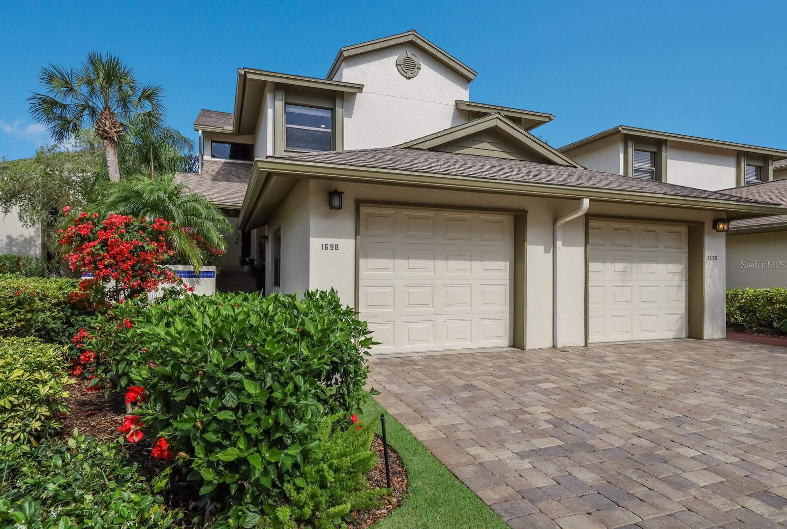 Welcome to this rarely available 3-bedroom end unit “Coach House” in the desirable and gated community of The Landings of Sarasota. Located on the second floor, you arrive in the open plan living area with voluminous vaulted ceilings. This desirable end unit has lots of windows with custom plantation shutters and you will feel like you have entered a private, tranquil, tropical retreat. As you look around the property you will notice the standard of the finishes throughout including bathrooms that were re modeled in the last few years and high quality porcelain tiled floors.
The living area is open concept making the space perfect for everyday living or entertaining. A previous owner enclosed the former lanai creating a beautiful dining area adjacent to the kitchen.
The Primary Suite also has high ceilings and is a very generous size with plenty of room for a desk or sitting area, plus a large en-suite bathroom with an oversized shower and deep tub. There are two further bedrooms, a beautifully updated guest bath with large walk-in shower and a convenient internal laundry.
The Landings is truly a one-of-a-kind gated community located West of the Trail with convenient access to shopping, restaurants, world class beaches and the cultural delights of downtown Sarasota. Ownership includes a membership to the Landings Racquet Club, offering 8 Har-Tru tennis courts, thermal dynamic pool, hot tub, fitness center, library, and lots of social activities. If you enjoy a slower pace, you can explore the lush treelined streets, launch your kayak into the ICW or enjoy sunsets on the dock at the end of the nature trail.
Don’t miss out on the opportunity to own this quality unit in the desirable community of The Landings.