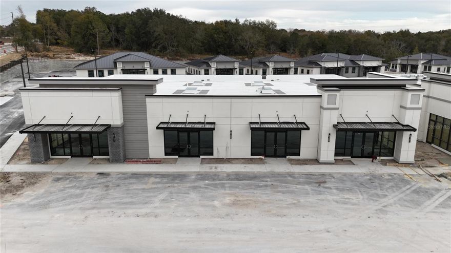 Under Construction. Building #05 is available for purchase at Lake Carter Exchange, a distinguished mixed-use development in Apopka’s East Shore at the intersection of Ocoee-Apopka Road and W Keene Road. In addition, this building is on the corner and has visibility from both roads. This dark gray shell retail building features a customizable interior, shared patio space and dedicated end-unit patio space. The shell delivery provides buyers with maximum flexibility to design the interior layout, with four front entrances supporting up to four unique suites. The development is strategically located less than one mile from Advent Health’s seven-story, 120-bed hospital and opposite a new Publix Supermarket development. Situated in the vibrant East Shore trade area, which includes 5,000 planned residences and an average household income above $100k, this Class A property is perfectly positioned for businesses targeting growth in Central Florida’s second-fastest-growing city. Contact us for pricing details/incentives and to schedule a tour of this exceptional commercial opportunity.
