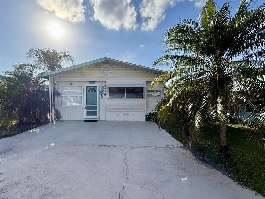 Welcome to Fairview Village, an active 55+ gated waterfront community in Winter Haven. This charming 2-bedroom home offers peaceful canal and lake views, with private access to the water between Lake Hamilton and Lake Henry—perfect for boating and fishing. The community features a 99-year land lease and a low HOA fee of just $90 per month, which includes water and sewer. Residents enjoy a heated swimming pool with nearby restrooms and changing facilities, well-kept shuffleboard courts, coin laundry, and secure RV/boat storage available for an additional fee. The clubhouse serves as the heart of the community, hosting a full calendar of events such as breakfasts, dinners, bingo, cards, billiards, ping pong, dances, shuffleboard, horseshoes, and more. Please note that this is a no-pet community. Fairview Village offers an inviting, active lifestyle with beautiful waterfront surroundings.