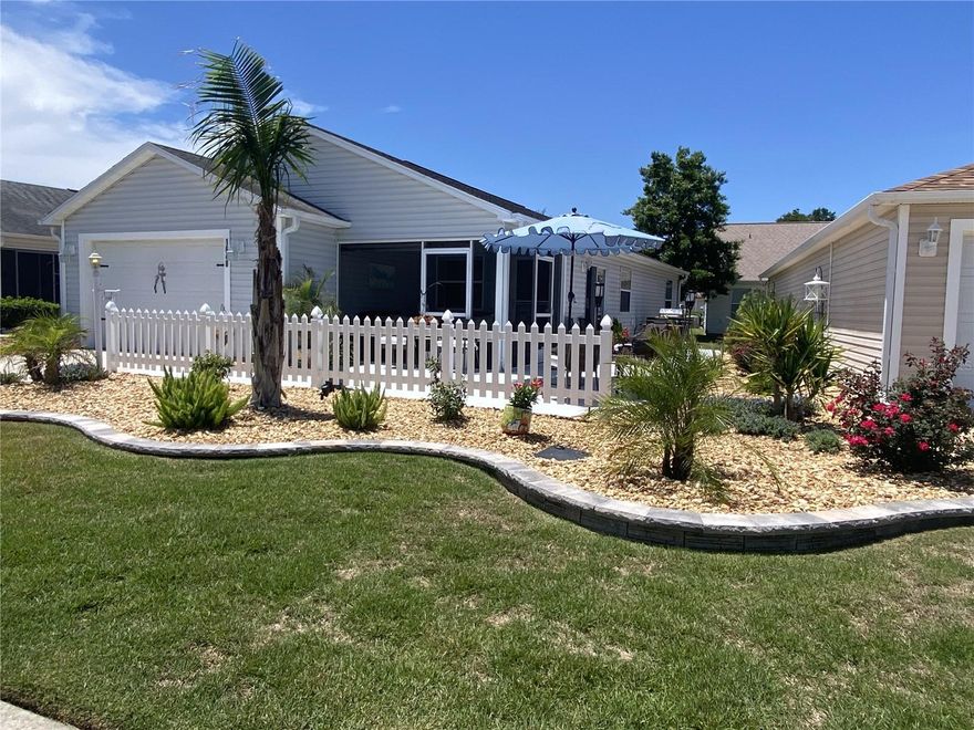 Colony Patio Villa - Exceptional location, right where you want to be! 10 minutes to Lake, Sumter, Landing, and 15 minutes to Brownwood paddock Square…. Doesn’t get any better! Welcome to this beautifully upgraded Patio Villa, where style, comfort, and outdoor living come together effortlessly. From the moment you arrive, you’ll be impressed by the lush tropical landscape and the expansive front and side patio—Well-suited for entertaining guests or simply relaxing.Go onto the newly painted patio and into the screened lanai, an ideal spot to enjoy your morning coffee or unwind in the evening while connecting with neighbors and friends. Inside, this bright and airy open-concept home features vaulted ceilings and luxury vinyl plank flooring that flows seamlessly throughout. The fully remodeled kitchen is a true centerpiece, showcasing elegant white cabinetry, quartz countertops, new stainless-steel appliances, crown molding, accent lighting, a spacious pantry, and a large eat-in bar—well-suited for casual dining or hosting. The generously sized primary suite offers a walk-in closet and a private en suite bathroom complete with a quartz countertop. The second bedroom is equally impressive, comfortably accommodating a king-sized bed with additional space to spare. A well-appointed second bathroom also features matching quartz finishes. Additional highlights include a one and ½ -car garage providing extra space for a golf cart, storage shelving, and new Kohler toilets in both bathrooms. This move-in-ready home is a must-see, offering both modern upgrades and inviting outdoor living. Turnkey option including a golf car available separately - Just bring your suitcase and start enjoying the lifestyle.