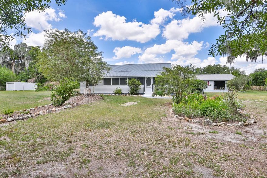 New price! Two homes on one beautifully landscaped property—ideal for multi-generational living, guests, or rental income!

The main home, built in 1925, blends classic charm with modern updates. It was completely replumbed and rewired in 2017. A metal roof was installed in May 2004 and updated in 2025 with wood Zac screws and a cricket was installed for the chimney. The AC was installed in 2016. In 2006 water was connected to the City water system and  remains on a 1,500-gallon septic tank system. 2023 the septic tank was pumped and cleaned out. The home was freshly repainted in 2025.

Inside, the layout includes a living room, dining room, kitchen, bedrooms, and a welcoming front porch. The primary bathroom features a walk-in shower and a large closet. A bonus room just off the primary bedroom, leading to the front porch area, can be used as an additional bedroom, office, study, or flex space.

The fenced yard is a true garden retreat, featuring fruit trees including Finger Lime, Pink Variegated Lemon, Sopapilla, and Longan, along with an array of flowering trees, shrubs, and vines such as Japanese Orchid Tree, Purple Jacaranda, Hibiscus (Jamaica), and Magnolias—ensuring something is always in bloom.

The second home, built in 2006, is fully self-contained with a full kitchen and full bath, making it perfect as a mother-in-law suite, guest house, or rental opportunity. The 2nd home was built in 1974 as a garage. Then it was totally remodeled into the house it is today in 2006. It offers 2 bedrooms, 1 bath, a separate entrance, and a one-car enclosed garage. This home was rewired in 2017 and the ceiling fans were updated in the living room and one bedroom. Home features a 2023 HVAC system, and was reroofed with shingles in 2025. The interior was repainted in 2025, and brand-new carpet was installed in the bedrooms. Both homes share the same septic system.

This versatile property offers space, income potential, and a lush, private setting—an exceptional opportunity for a wide range of living arrangements.

Please call for a private showing!