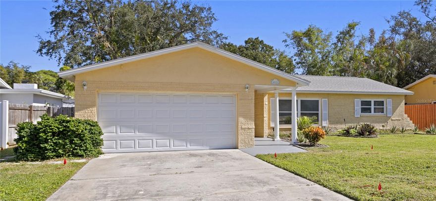 Welcome to your dream abode nestled near the serene beauty of Tampa Bay! This charming 3-bedroom, 2-bath home is a picture-perfect haven that seamlessly blends comfort and style. The sturdy block construction ensures durability, while the two-car garage provides convenient parking and storage space. Step inside to discover a cozy and inviting atmosphere, where each room tells a story of modern updates and thoughtful design.   The well-appointed kitchen boasts contemporary finishes, including newer appliances, farmhouse sink, and a natural gas stove making meal preparation a delight. Whether you're entertaining guests or enjoying a quiet family dinner, this space is as functional as it is beautiful. The open layout flows seamlessly into the living areas, creating an ideal environment for both relaxation and socializing.  On one side of the home, the master suite awaits, creating a retreat and privacy.  Inside the primary suite you'll find a large walk-in closet and an updated en-suite with a walk-in shower. Meanwhile, the two additional bedrooms are strategically placed on the opposite side of the home, offering a sense of separation and tranquility. This thoughtful design ensures that family members or guests enjoy their own space, complete with easy access to the hall bathroom that has been fully updated and has a jet tub, large vanity, and a linen closet.  More features to LOVE: 2019 gas tankless water heater, fully-fenced back yard, sidewalks in the neighborhood, 2018 roof, newer windows, 2019 a/c, updated interior paint, gorgeous porcelain tile throughout the home, and LOCATION.  This home is convenient to shopping, restaurants, and minutes to downtown St. Pete, Trader Joes and Publix.  A short commute to Shore Acres Elementary School, Denver Park, and Tampa Bay where you can enjoy boating, kayaking, and fishing.   This home offers the perfect combination of a peaceful retreat and proximity to vibrant city life. It's not just a home; it's a thoughtful sanctuary with a split floor plan designed to enhance your everyday living experience. Welcome to a life of comfort, convenience, and contemporary elegance!   Schedule a showing today!!