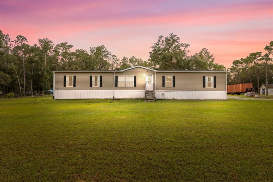 Discover the perfect blend of peaceful country living and modern comfort on nearly 5 fenced acres in the heart of Brooksville. This 4-bedroom, 2-bathroom home offers over 2,200 square feet of living space with an open layout and all the flexibility you need for family, guests, or hobbies.

Step inside to find two spacious living areas, a large dining space, and a bright kitchen with plenty of cabinets, a center island, and newer appliances. The primary suite is tucked away for privacy and features dual walk-in closets, a soaking tub, separate shower, and double vanity. The split floor plan places three additional bedrooms and a full bath on the opposite side of the home, giving everyone their own space.

Outside, you’ll love the setup — a covered and screened rear porch perfect for relaxing or entertaining, a private above-ground pool with deck, and a large detached workshop/garage equipped with 30-amp and 50-amp RV hookups and ample power for tools or toys. The circular drive and paved parking area provide room for trucks, trailers, and RVs, while the cross-fenced pasture and outbuildings make it easy to keep animals or run a small hobby farm.

Enjoy the balance of cleared, usable land and shaded wooded acreage for privacy. Located in Istachatta Acres, this home offers the quiet of rural life just minutes from the Withlacoochee River, trails, and Brooksville’s local conveniences.

Whether you’re looking for a homestead, small farm, or simply room to breathe — this property checks every box.