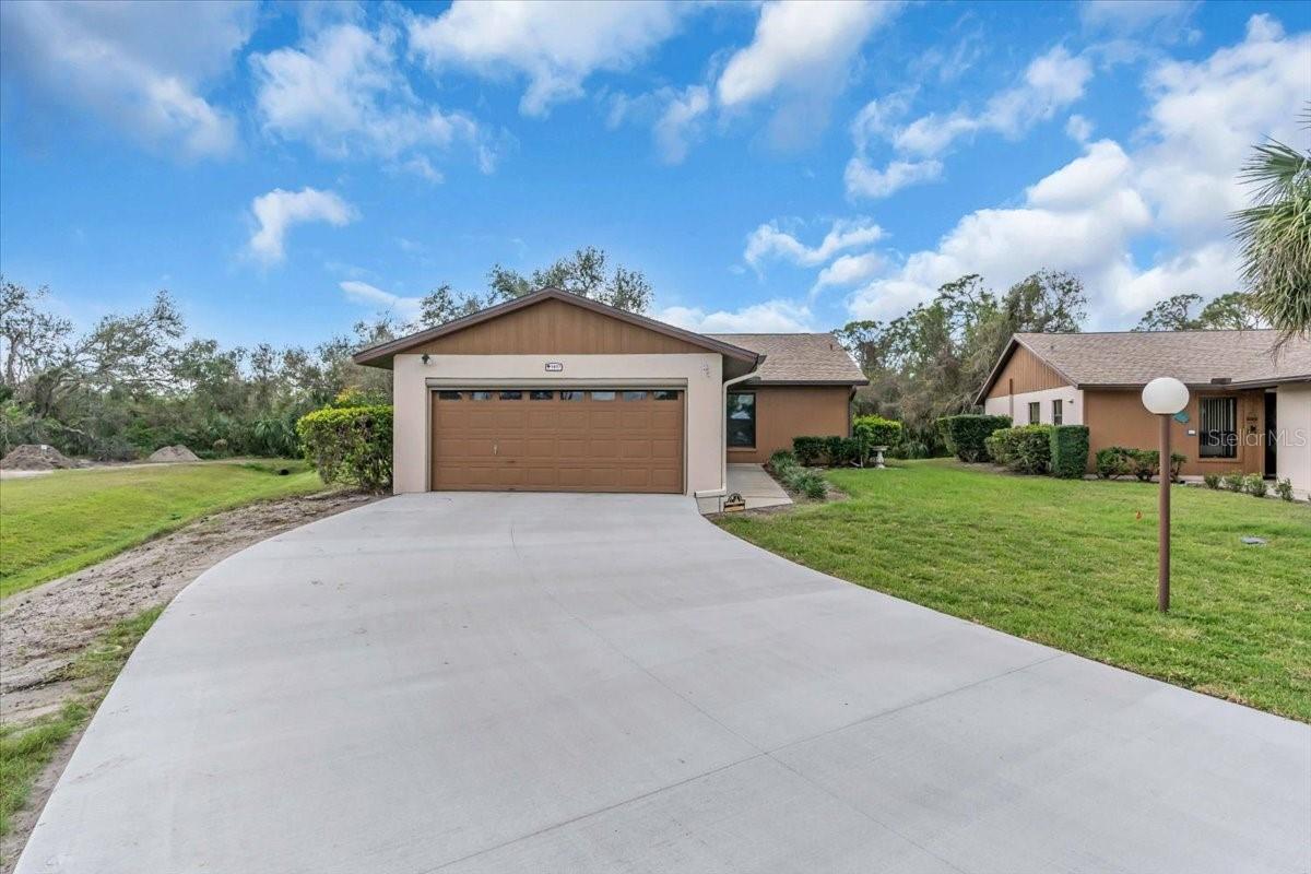 GREAT NEW PRICE! Do not miss out by making an appt now to view this ONLY FREE STANDING VILLA in CURRY COVE in Nokomis Florida! A 55+ community with views of open space and sits on a cul-de-sac. Well maintained 2-bedroom, 2-bath home with good size kitchen. Dining Room to Living Room combination to Lanai with preserve view to back view plus open space greenery to left of home. Vaulted Ceilings. Situates like a single family home. No attached home. Enclosed 2 car garage with double garage door. This home has plenty of storage space! Garage space: 25.3 x 18.6!
Brand new concrete driveway, new roof, upgraded doors/closet doors, laminate flooring, HURRICANE IMPACT WINDOWS, and Lanai Doors. HOA covers: Landscape, lawn-care, community pool/maintenance, exterior pest control, roof, exterior painting, mulch as needed and cable! Do not miss this gem. Convenient to downtown Venice entertainment, shopping and dining, Venice and Nokomis Beaches, Sarasota Memorial Hospital, Venice/Nokomis location minutes away. Easy travel to Highway 75, Tamiami Trail (Route 41) to Sarasota attractions or south to Manasota Key, Sarasota/Bradenton International Airport (SRQ) approximately 30/40 minute drive. Quick close possible.