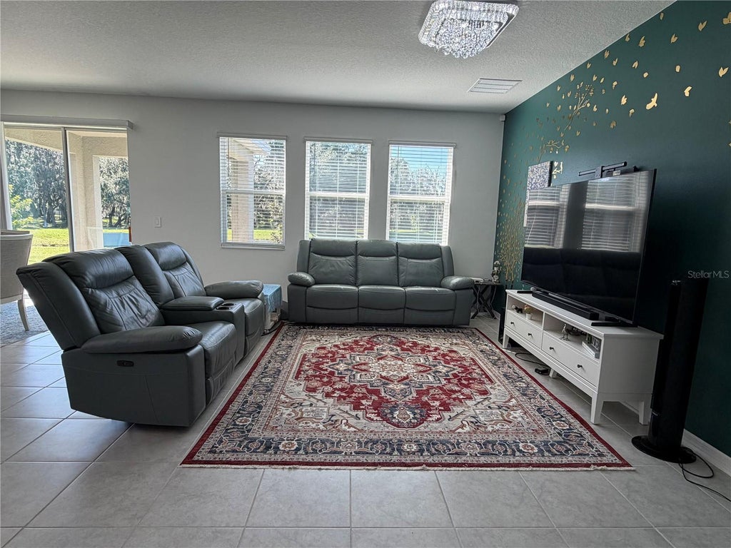Photo of 1913 Cricket Cradle Drive, Kissimmee, FL 34746 (MLS # O6452540)