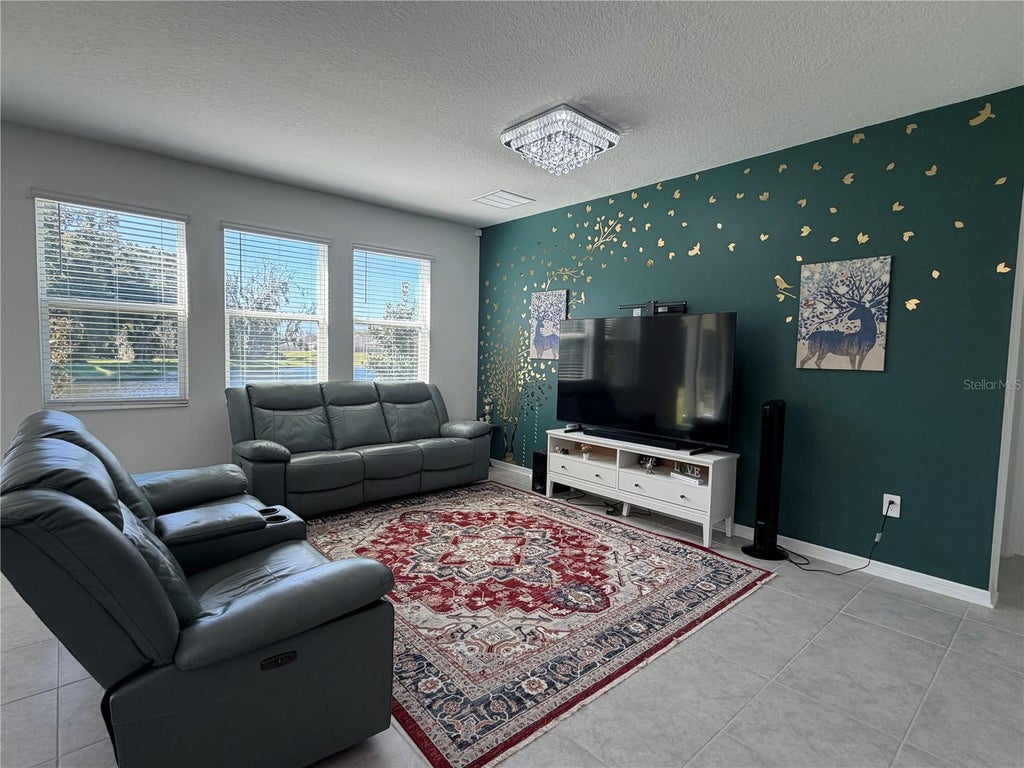 Photo of 1913 Cricket Cradle Drive, Kissimmee, FL 34746 (MLS # O6452540)