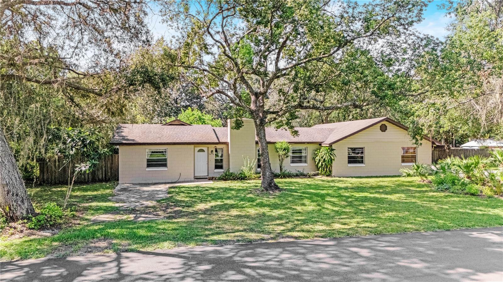 Discover a rare find in DeLand—2428 W. Orange Rd. This 3-bedroom, 2-bath home offers 1,452 sq ft of living space, but what truly sets it apart is everything that comes with it. Sitting on a half acre, this property delivers space, privacy, and features you won’t easily find anywhere else.
Inside, fresh updates make this home feel brand new. You’ll find brand new LVP flooring throughout (never lived on), crisp interior paint, and no carpet anywhere. Both bathrooms feature brand new toilets, giving you peace of mind from day one. The layout offers a living room up front plus a separate large family room in the back—perfect for spreading out or entertaining. A cozy fireplace adds warmth to the living space, while the oversized indoor laundry room keeps things convenient. The master suite includes a walk-in closet for plenty of storage.
The sunroom, finished with charming Spanish tile, provides a relaxing space to enjoy the backyard view. Step outside and you’ll find even more to love: a fenced yard with double gate access, a gardening area, wood storage shed, and a spacious pole barn with electricity.
For car enthusiasts or anyone needing serious storage, the rare 4-car garage with exhaust fan is a true standout. Add in a newer HVAC and this home checks all the boxes.
This property is vacant, move-in ready, and waiting for its next chapter. Homes like this—on a double lot, with a 4-car garage, pole barn, and storage options—don’t come around often in DeLand.
Schedule your tour today before it’s gone.